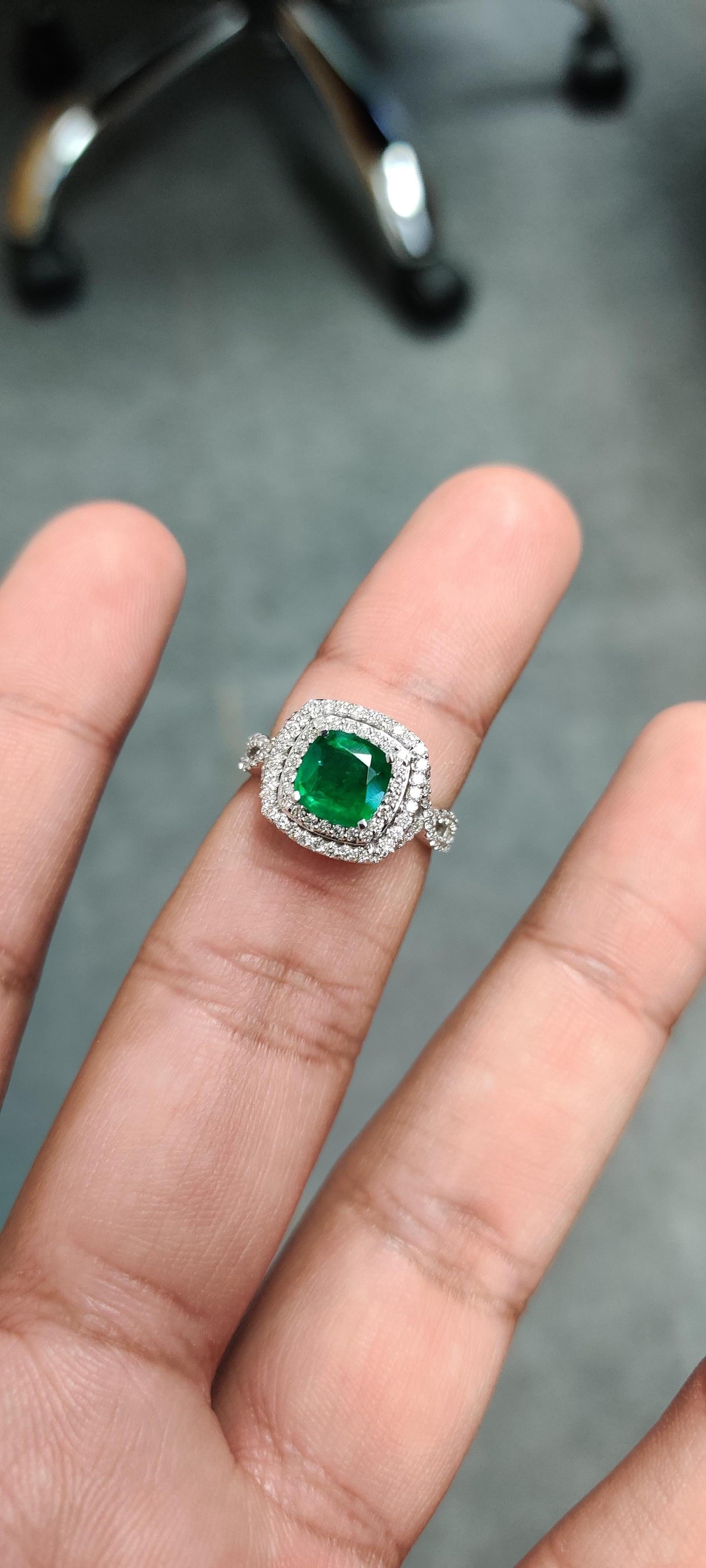 Introducing our stunning 18K Gold Emerald Ring, a radiant symbol of sophistication and grace. This captivating piece features a vibrant 1.26 carat emerald sourced from Zambia, renowned for its rich color and exceptional clarity. Enhanced with minor