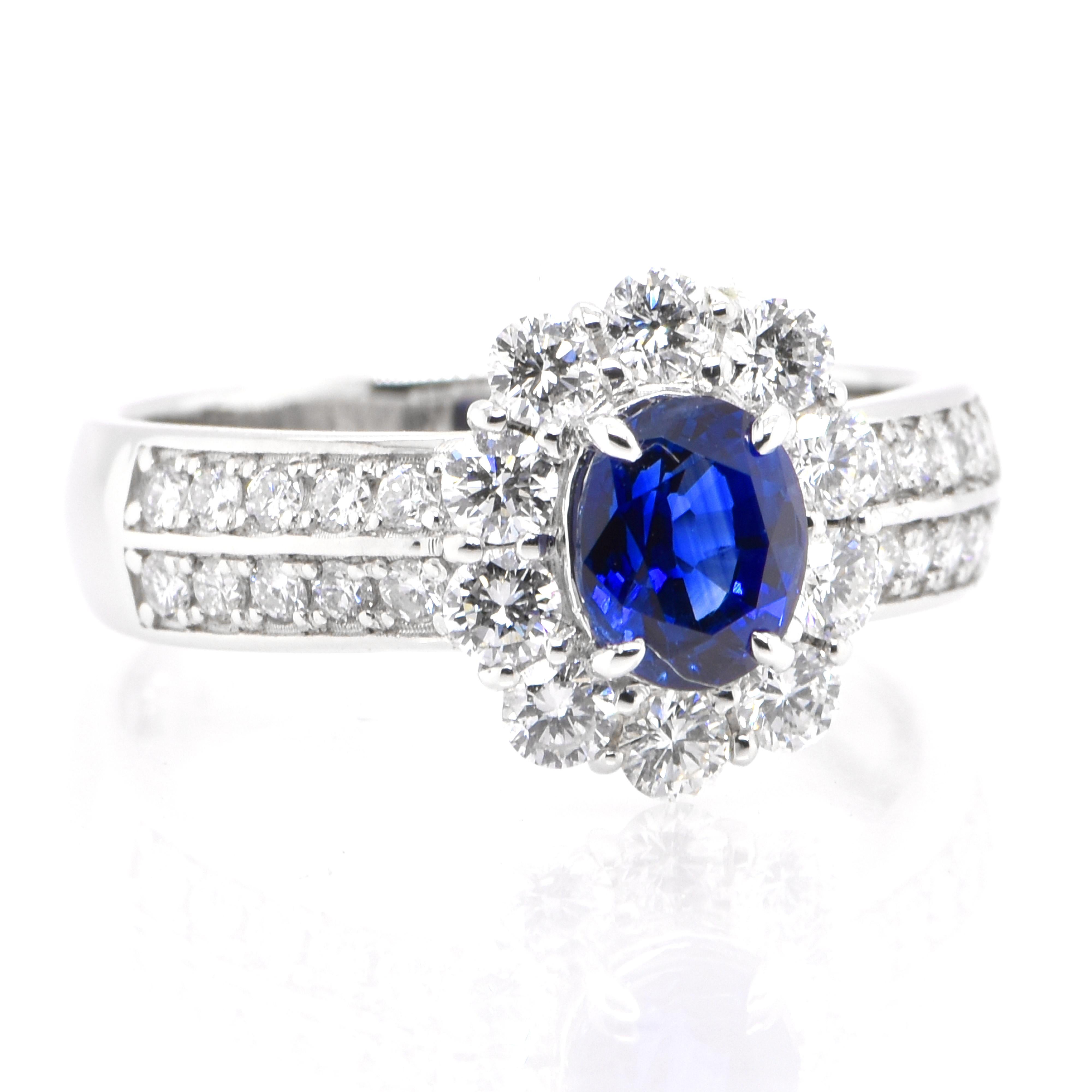 Modern 1.26 Carat Natural Blue Sapphire and Diamond Halo Ring Set in Platinum For Sale