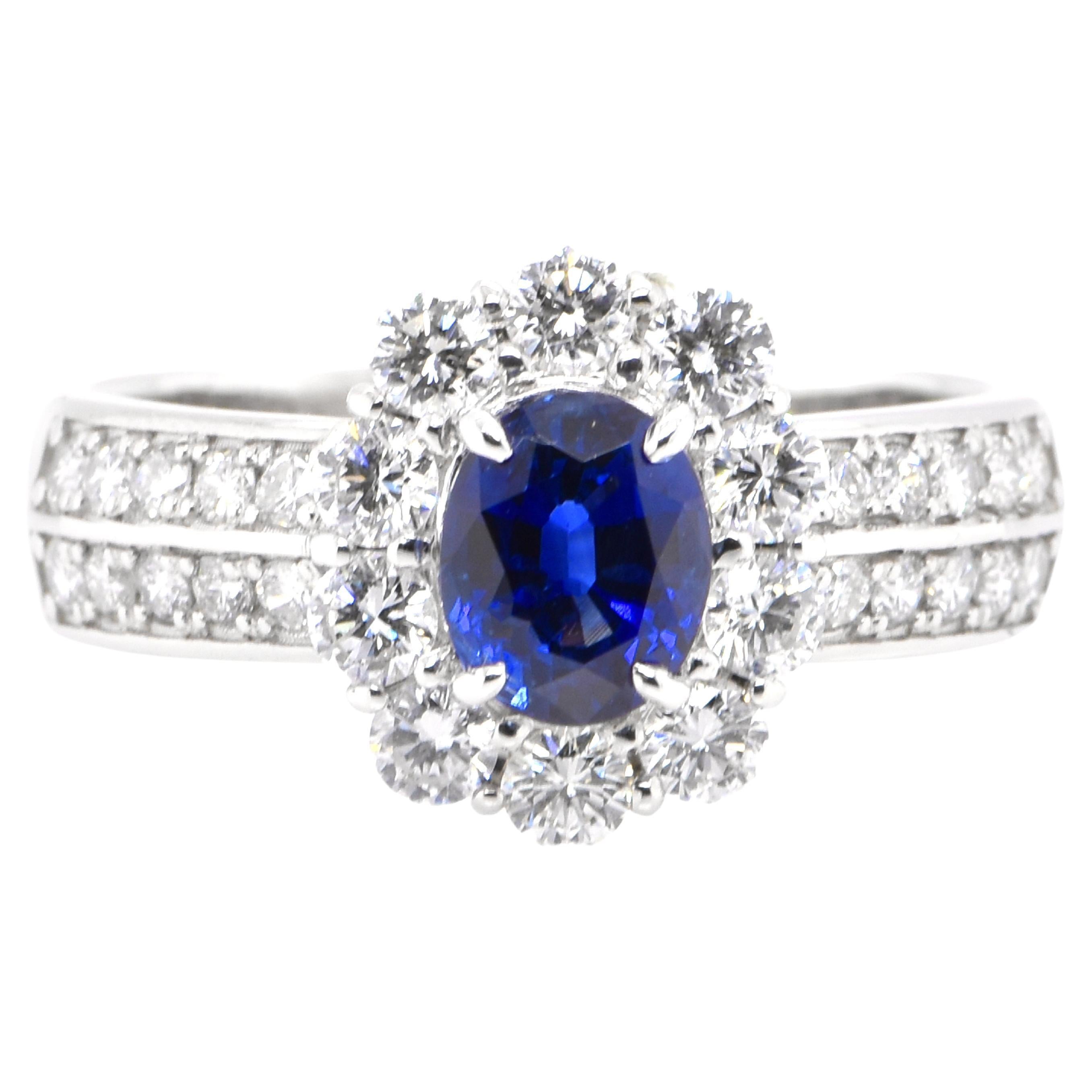 1.26 Carat Natural Blue Sapphire and Diamond Halo Ring Set in Platinum For Sale