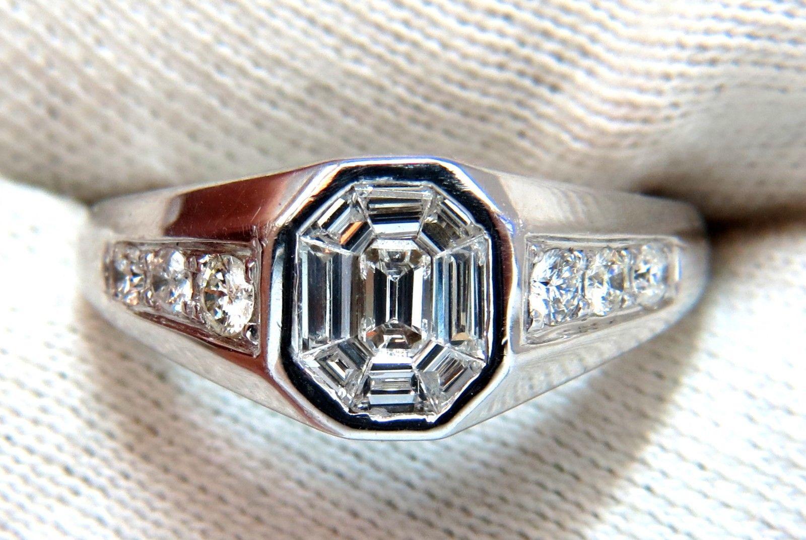 Emerald Cut Cluster Classic

Large Diamond Illusion 

Mens Durable Cluster diamond ring.

1.26ct Emerald cut & Baguette diamonds in center,

& Round Diamonds On Shoulders.

 Vs-2 / Si-1 clarity

G-H color.

18kt. white gold.

6.8 grams

Ring is