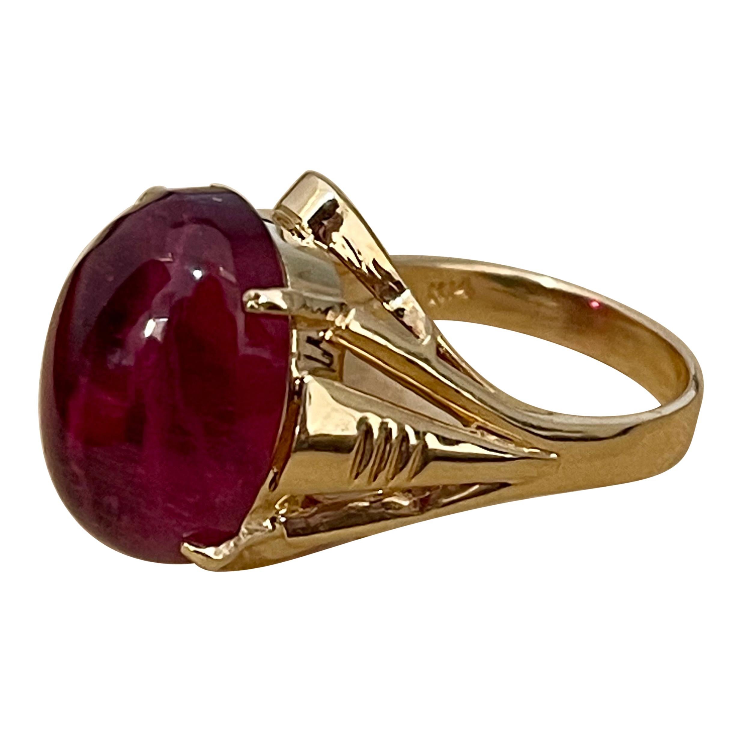  12.6 Carat Oval Cut  Cabochon Pink Tourmaline 14 Karat Yellow Gold Ring Size 6
12.6 Carat of Pink Tourmaline oval shape  surrounded by nice gold design.
Gold: 14 Karat Yellow  gold , Beautiful design
Weight: 7.4 gram Including stone

Ring Size 6 (