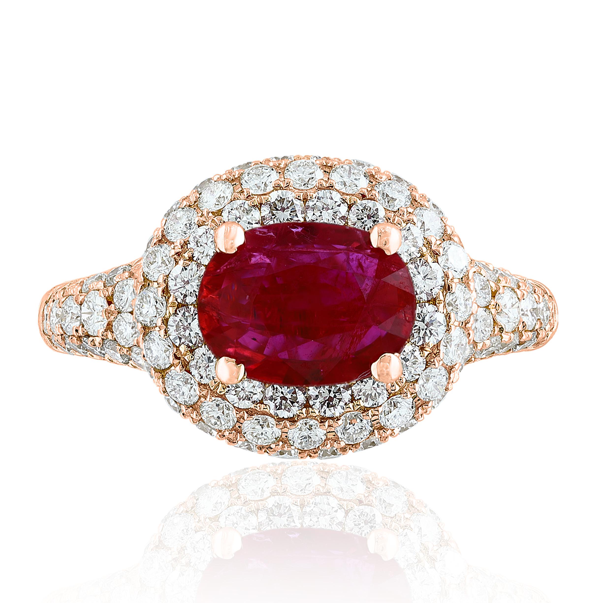A uniquely-designed ring showcasing a 1.26 Carat Oval Cut Ruby surrounding the center stone are brilliant-cut round diamonds in an 18 karat rose gold mounting. 124 diamonds weigh 1.67 carats in total.