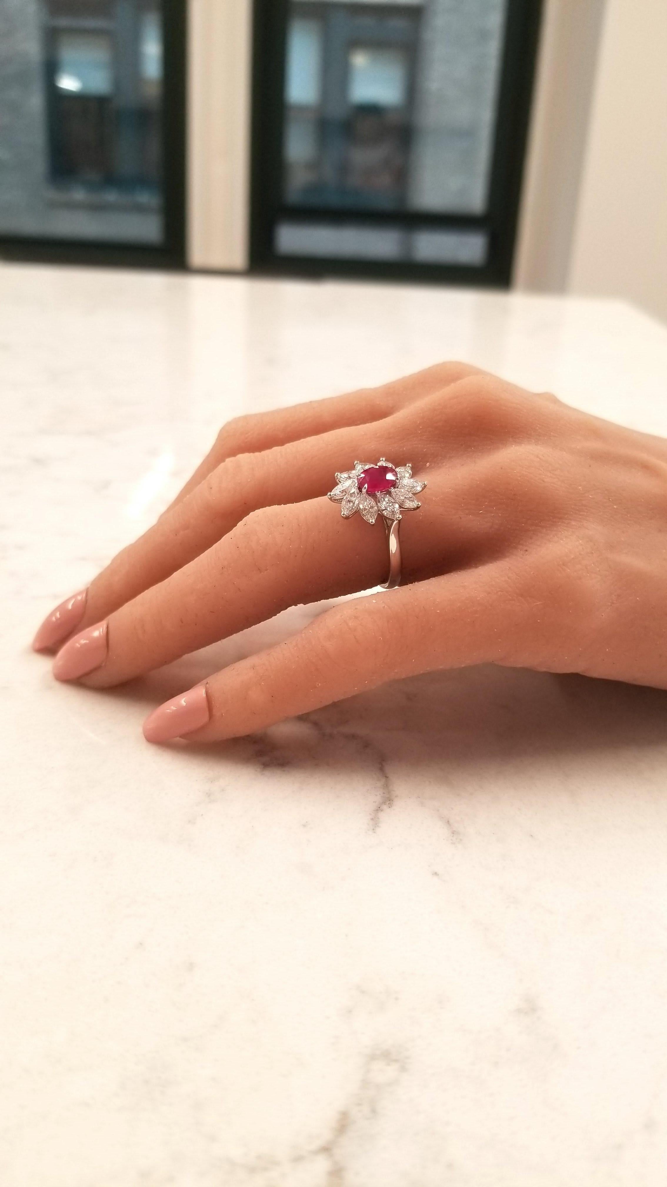 This is a cocktail ring featuring a 1.26 carat, oval brilliant, red ruby measuring 7.2x5.2mm. The gem source is Myanmar. Its color is blood red with no modifed colors. Its transparency and luster are superb. The vibrant red is complemented by a