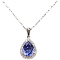 Used Bespoke Tanzanite 1.25Carat Pear 0.30 Carat Diamond 18Kt Gold Chain Halo Pendant