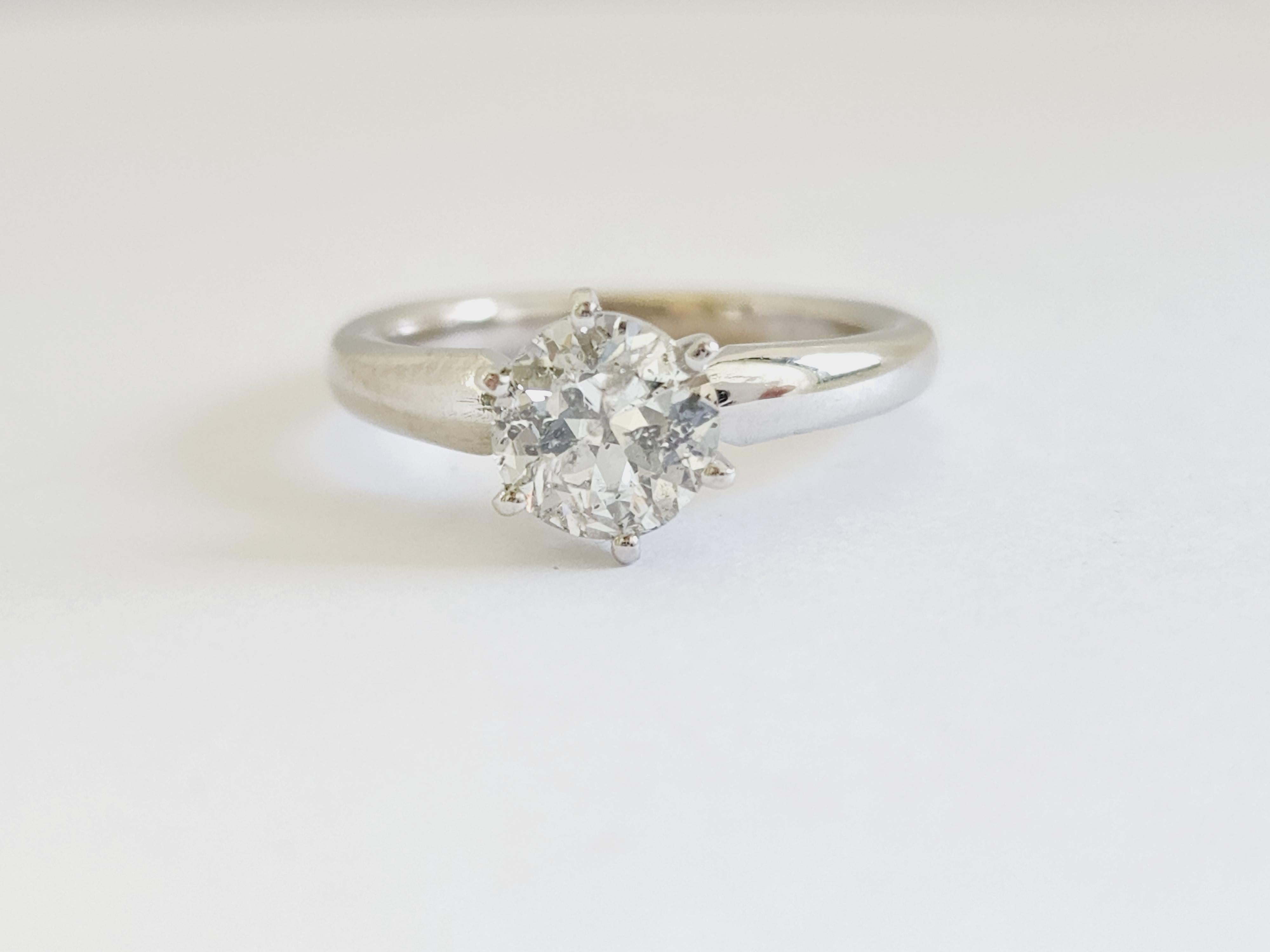 1.26 ct round brilliant cut natural diamonds. 6 prong solitaire setting, set in 14k white gold. Ring Size 6.5.