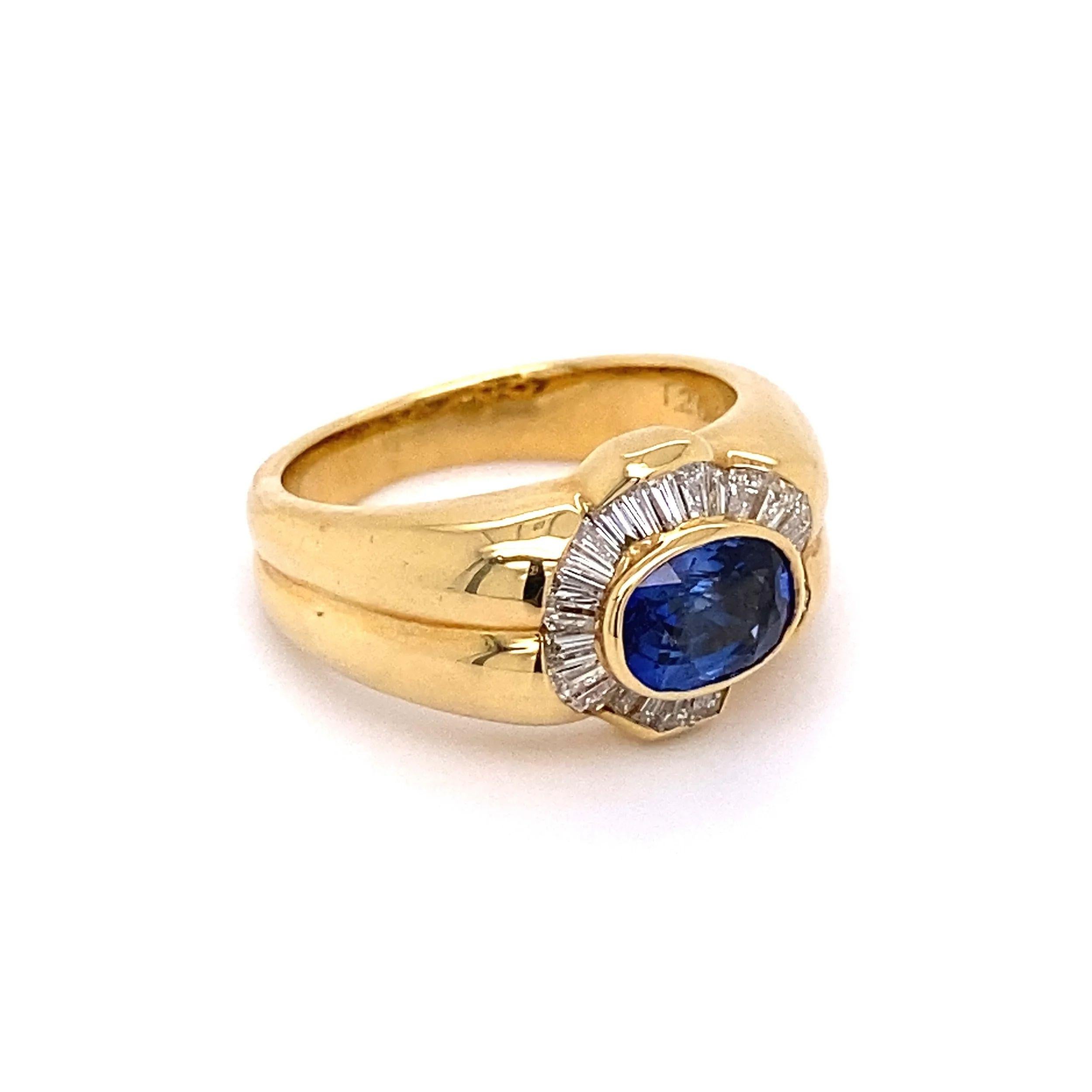 Simply Beautiful! Finely detailed Vintage Sapphire and Diamond Gold Ring. Centering a securely nestled Hand set Oval Sapphire, weighing approx. 1.26 Carats. Surrounded by Baguette Diamonds weighing approx. 0.67tcw. Approx. dimensions: 0.91” l x 0.