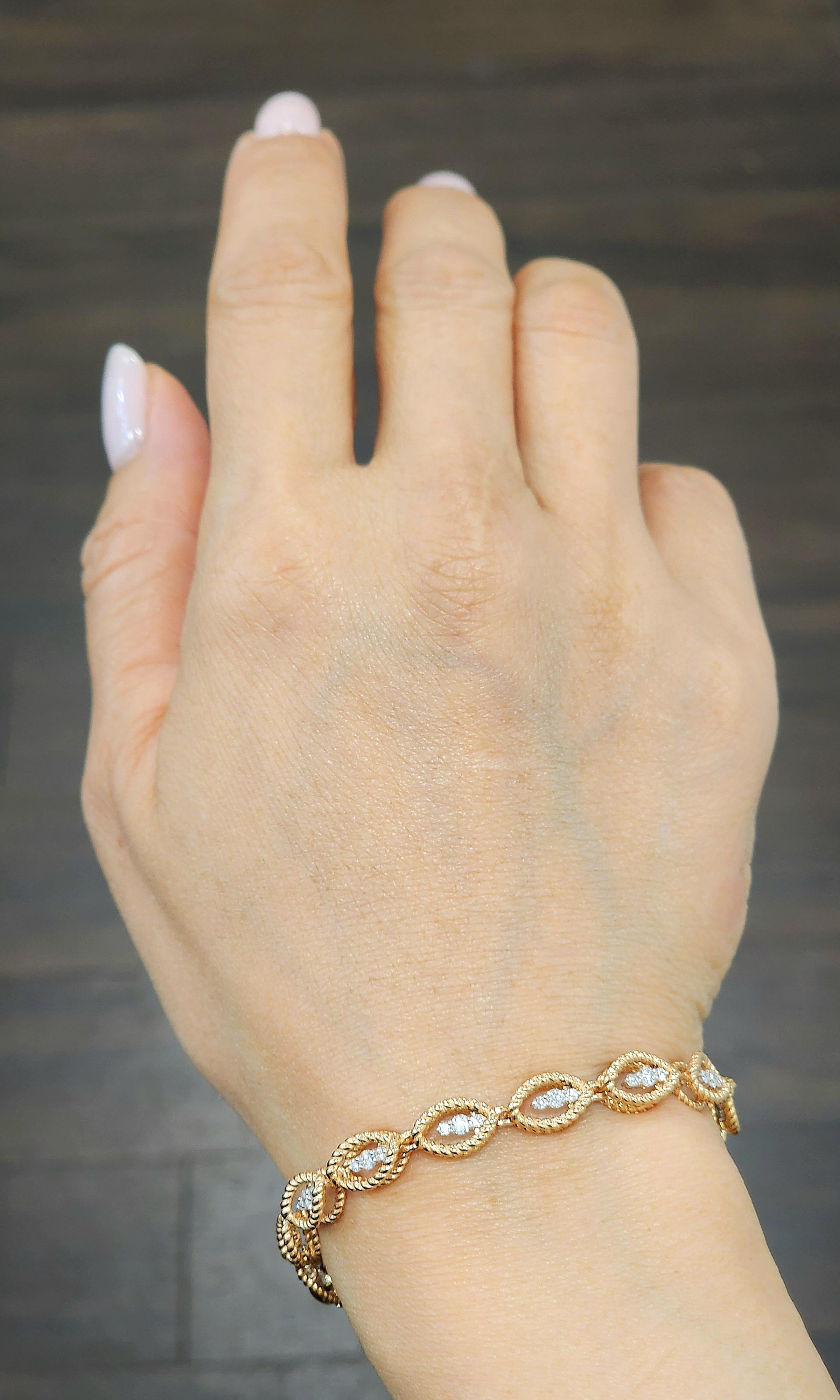 This exquisite link bracelet showcases round white diamonds with a total carat weight of 1.26. The diamonds are E/F in color and have a clarity of VS1/VS2. Crafted in 18k gold, the bracelet features a blend of white and yellow gold. Designed by
