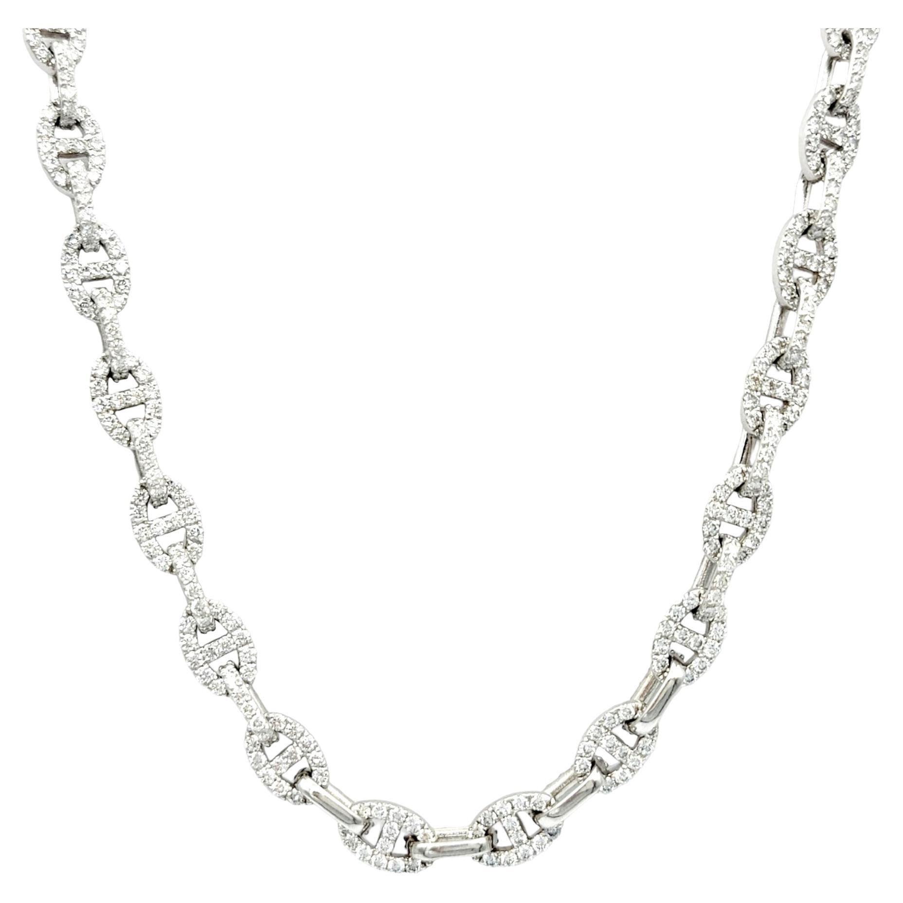 This luxurious oval chunky link necklace, a masterful creation set in the enduring beauty of 18-karat white gold, is an absolute  marvel. The bold and distinctive design of the elongated links elevates the necklace, creating a captivating canvas for