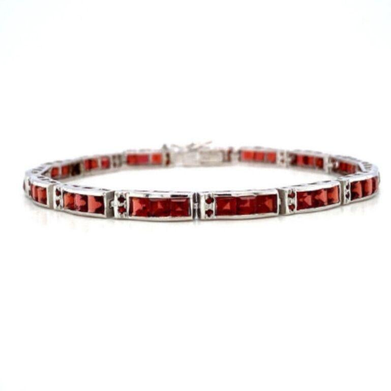 Beautifully handcrafted silver garnet tennis bracelets, designed with love, including handpicked luxury gemstones for each designer piece. Grab the spotlight with this exquisitely crafted piece. Inlaid with natural garnet gemstones, this bracelet is