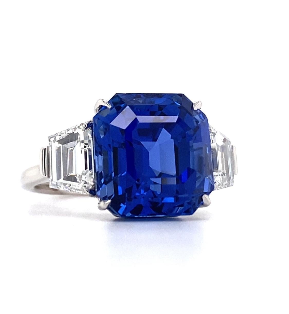 12.61 carat Square Emerald Cut Blue Sapphire with two Trapezoid Diamonds 1.94 carats set in a handmade Platinum ring