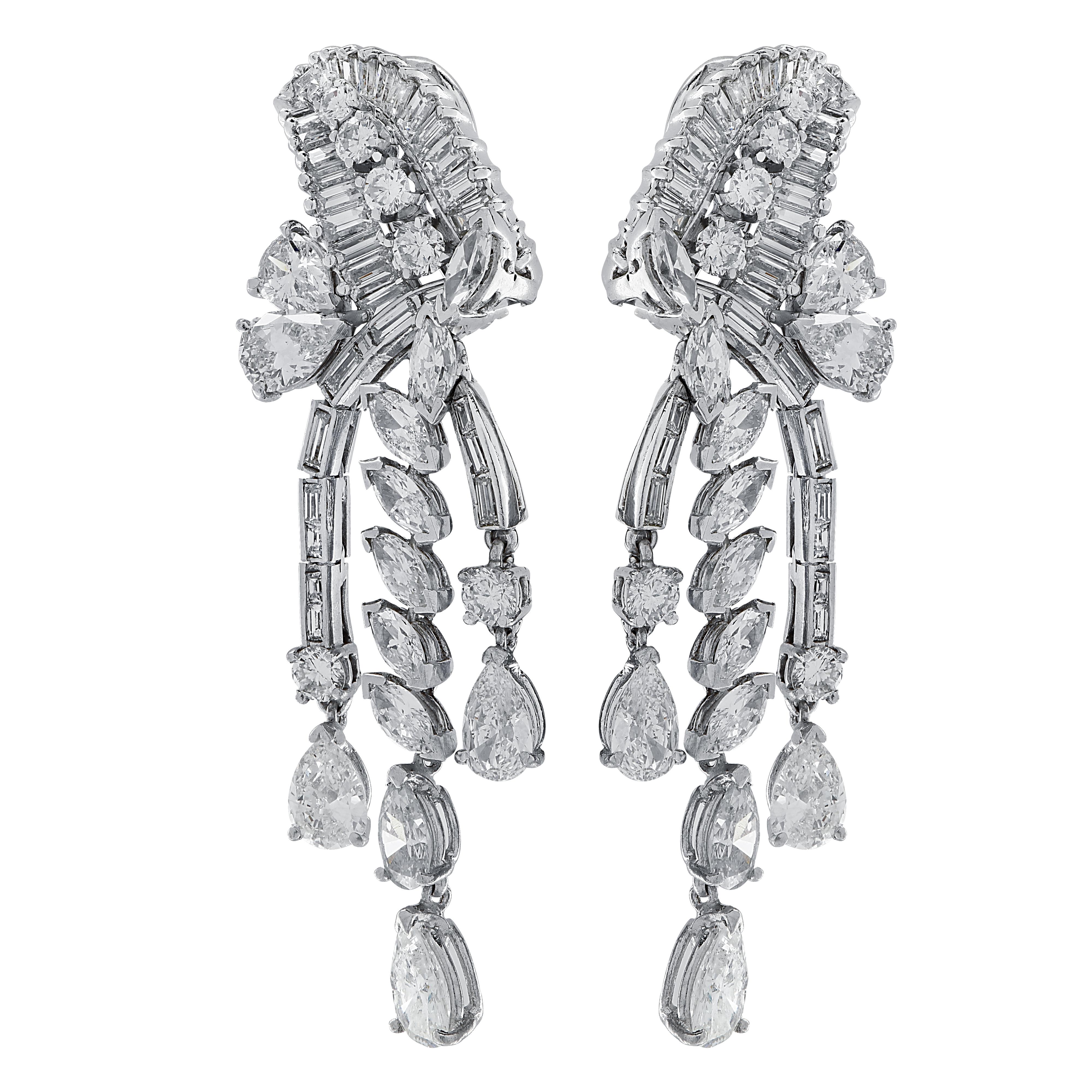 Sensational clip-on dangle earrings crafted in platinum, showcasing 147 mixed cut diamonds weighing approximately 12.65 carats total. 12 pear shape diamonds weighing approximately 6.40 carats total, 10 round brilliant cut diamonds weighing
