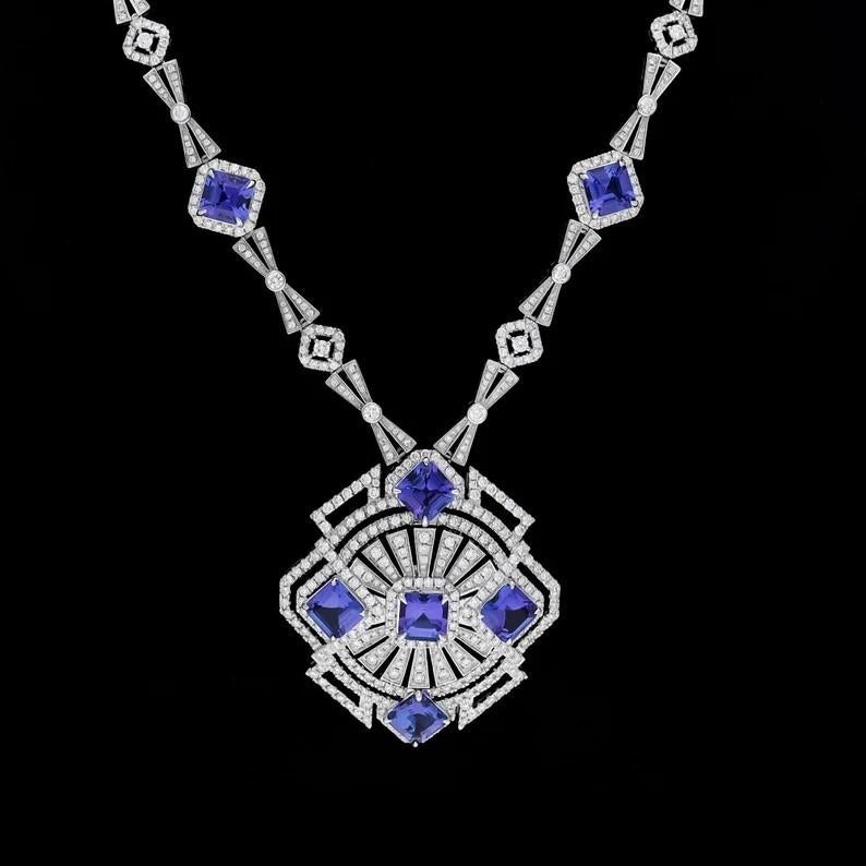Cast from 18-karat gold, this exquisite necklace is handset with 12.65 carats Tanzanite and 6.62 carats of sparkling diamonds. See matching earrings, sold separately.

FOLLOW MEGHNA JEWELS storefront to view the latest collection & exclusive pieces.