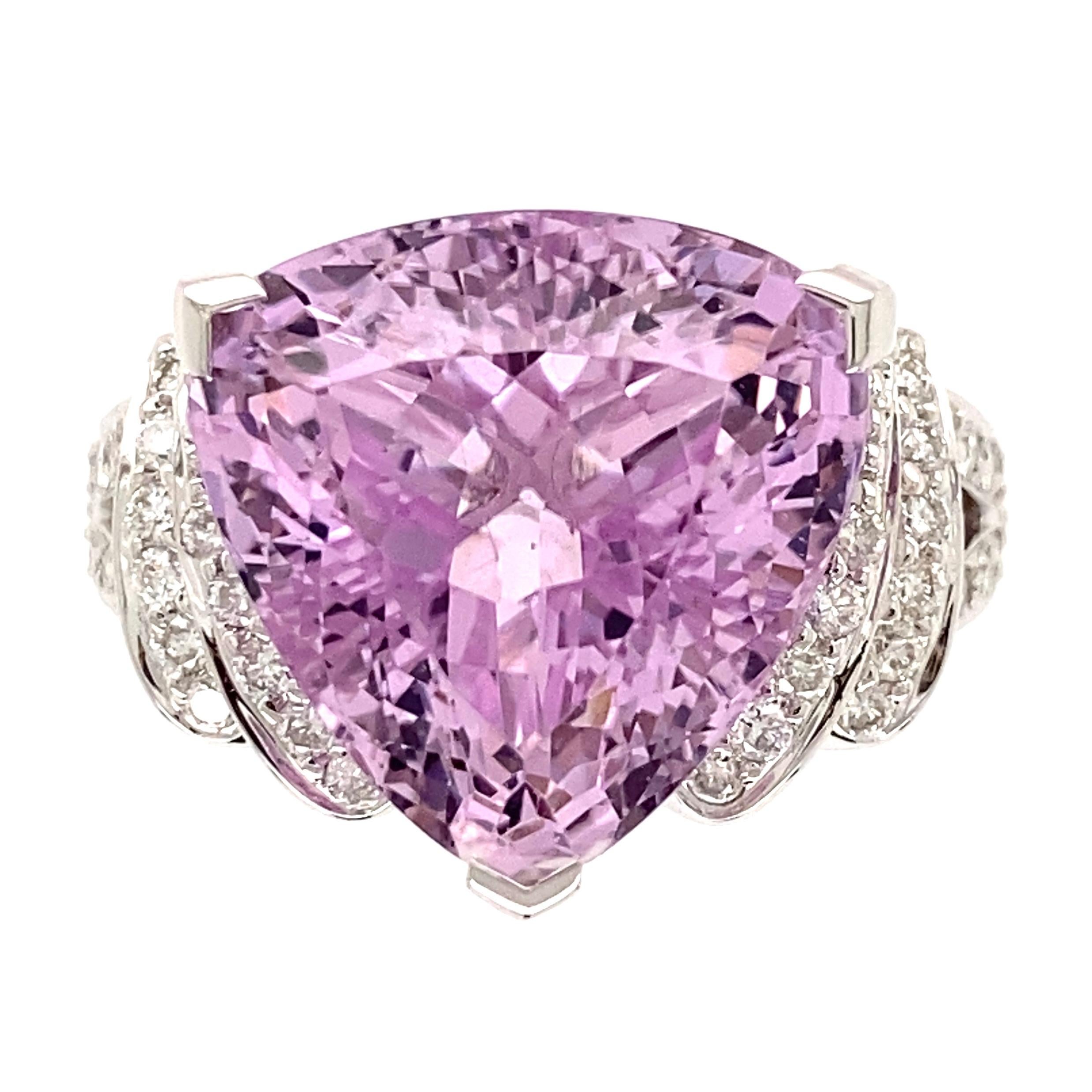 Simply Beautiful! Trillion Kunzite and Diamond Gold Cocktail Ring. Securely Hand set with a Trillion Kunzite, weighing approx. 12.65 Carats and Diamonds weighing approx. 0.58tcw. Hand crafted 18K White Gold. Measuring approx. 1.16” l x 0.88” w x