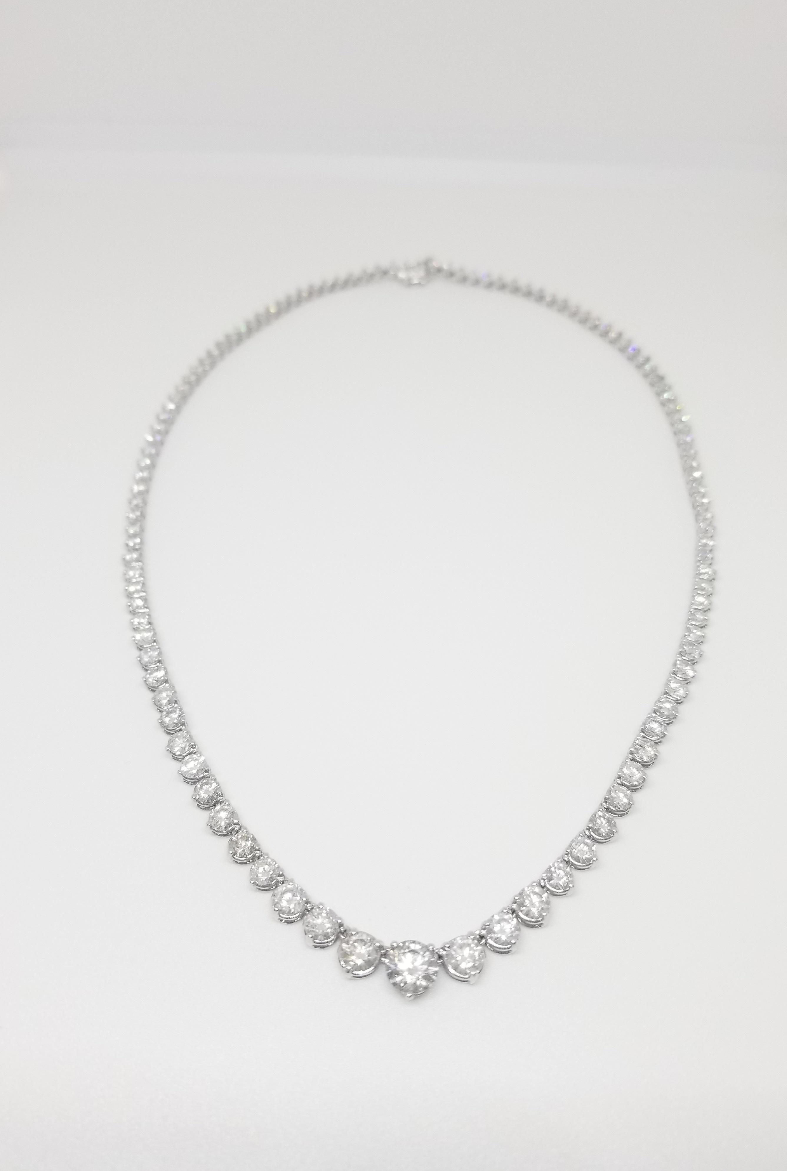 Stunning 14 Karat White Gold Round Brilliant Cut Diamond Tennis Necklace set on 3- prong setting. The total diamond weight is 8.72 carats. The closure is an insert clasp with safety clasp. Length is 16 inches. center stone 0.60ct. VERY SHINY EYE