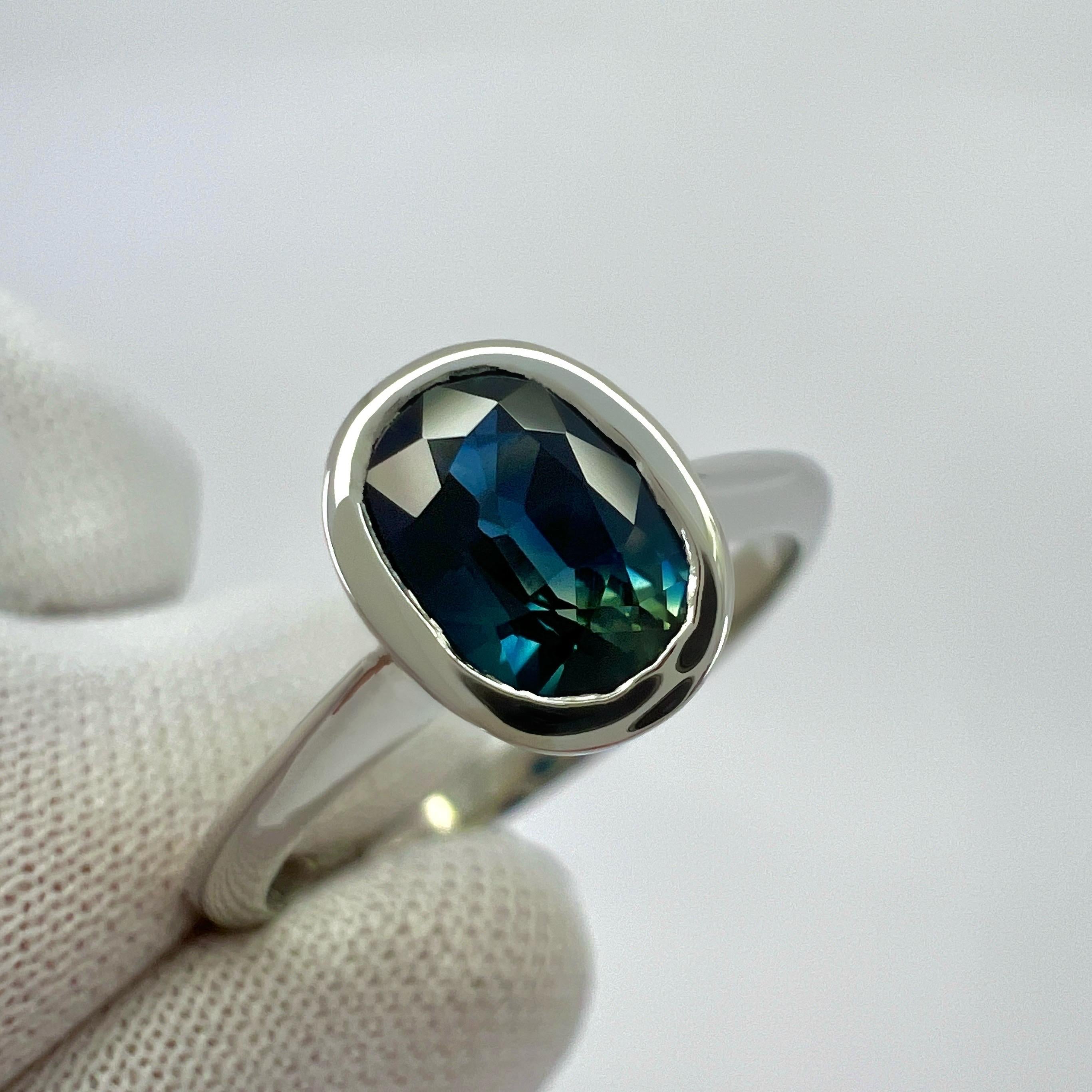 Women's or Men's 1.26ct Bi Colour Blue Green Sapphire Oval Cut Platinum Solitaire Bezel Set Ring For Sale