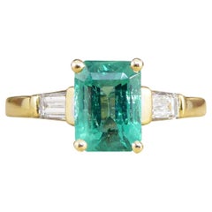 1.26ct Emerald Ring with Baguette Cut Diamond Shoulders in 18ct Yellow Gold