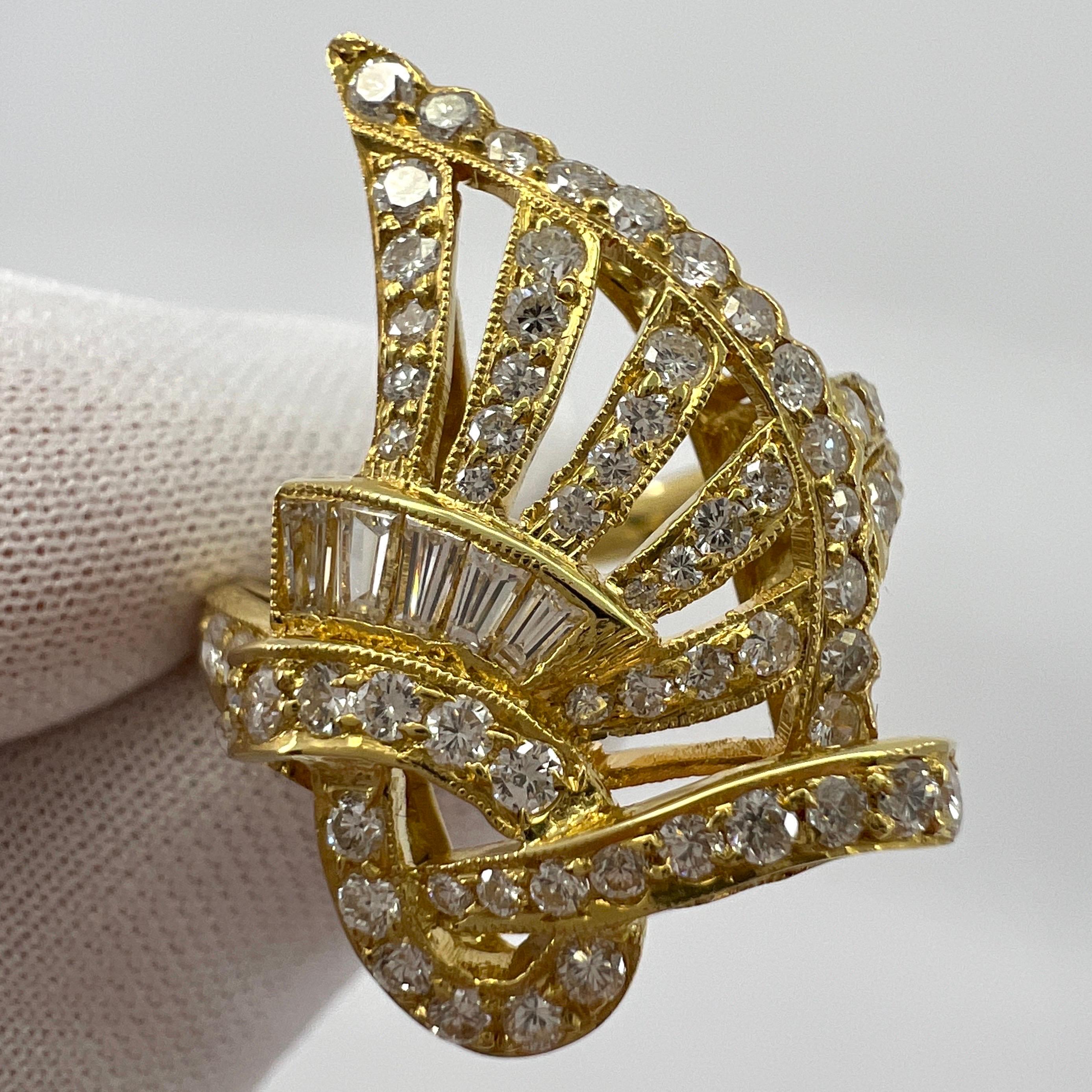 Fancy Natural White Diamond Swirl Round & Baguette Cut 18k Yellow Gold Fancy Statement Ring.

1.26 Carat of diamonds set in a beautifully crafted fancy swirl design ring. A bold and bright statement piece.

1.08ct of round brilliant diamonds and