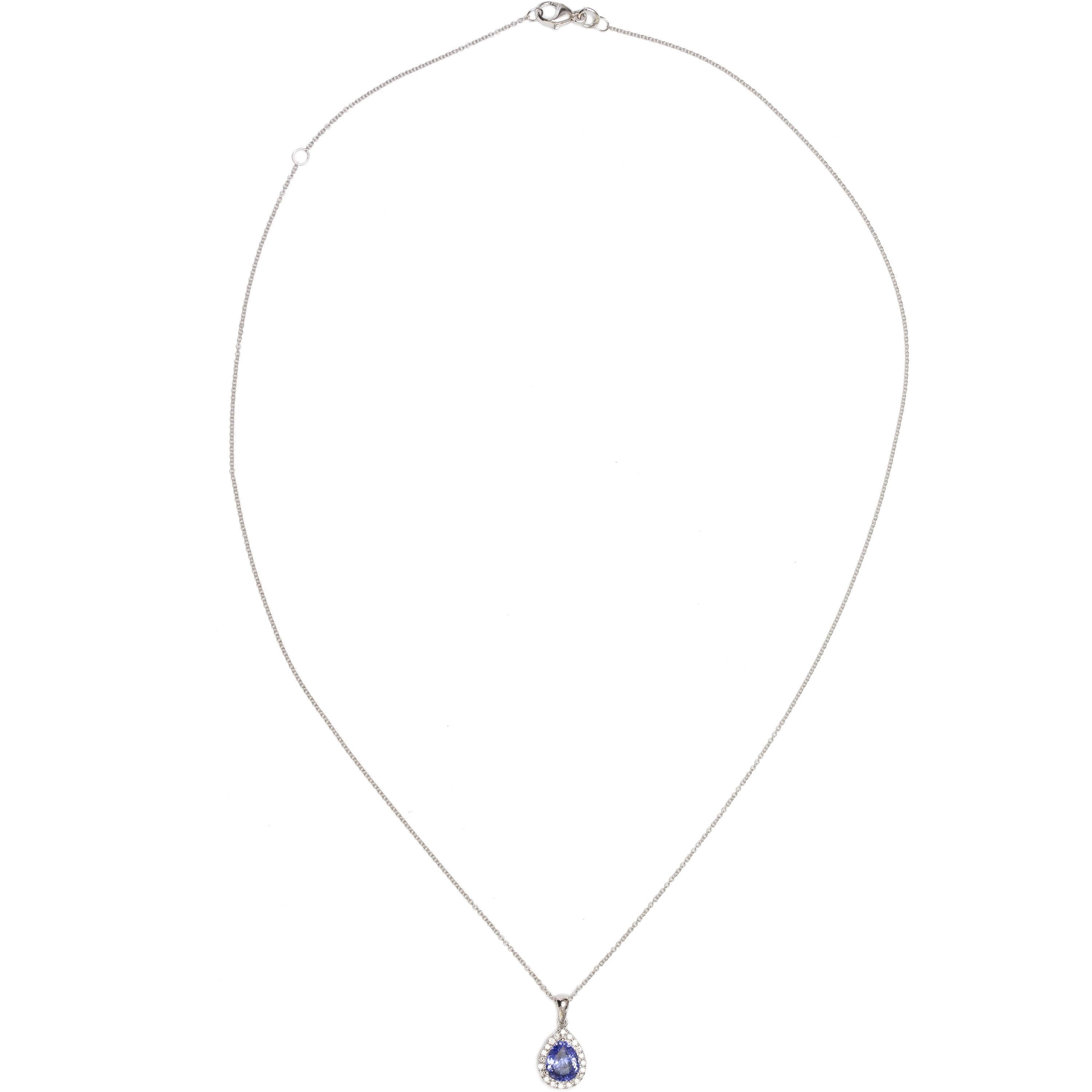 Bespoke Pear Shape Pendant with intense purple and 1.26 Carat  Blue Tanzanite, centre with halo set design sparkling natural white diamonds colour G / H clarity VS /SI Round Brilliant Cut.
This modern interpretation of a classic look is brought to