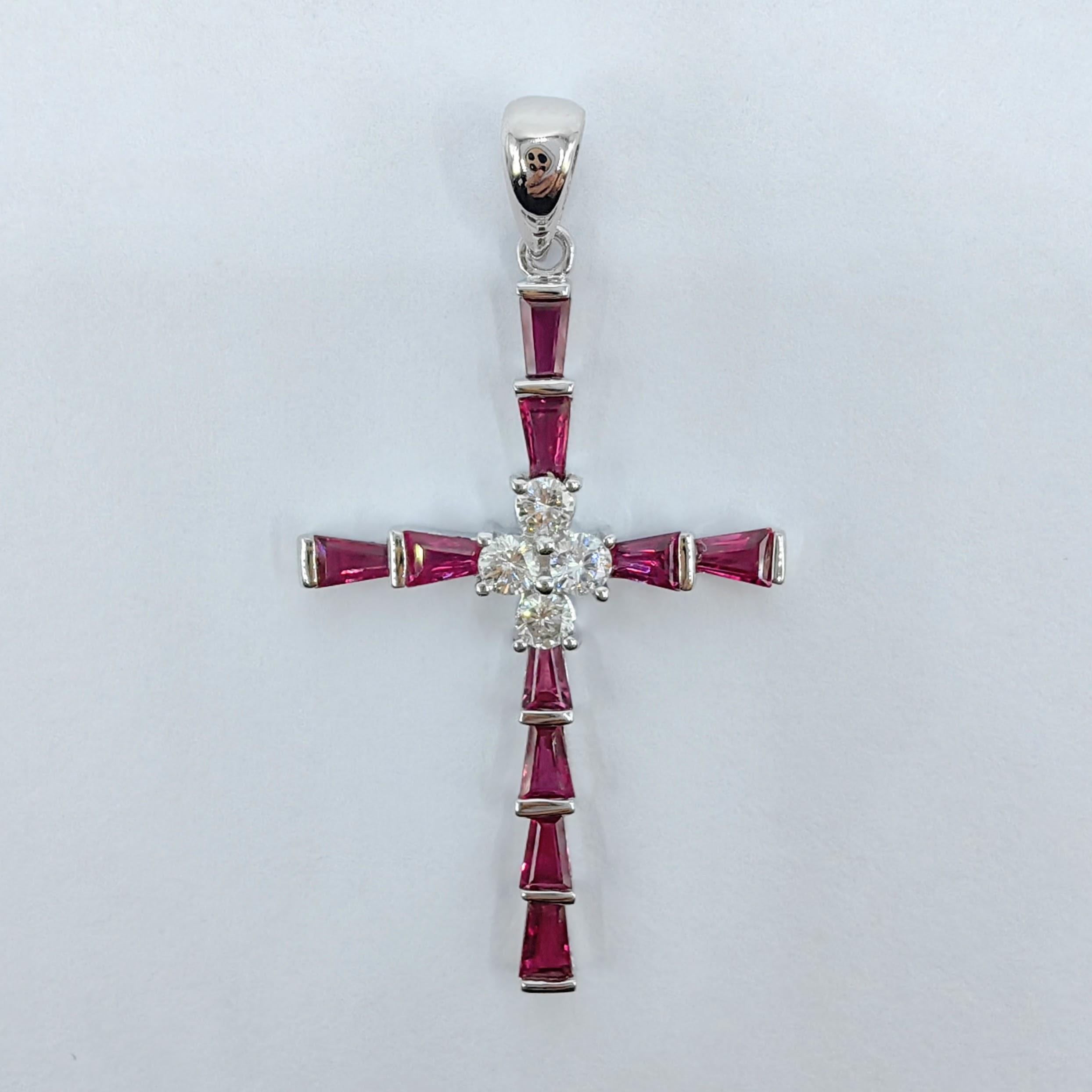 Introducing our exquisite 1.26ct Ruby & Diamond Cross Pendant Necklace in 18K White Gold. This stunning piece of jewelry combines the timeless elegance of pigeon blood rubies and diamonds, creating a symbol of faith and beauty.

The cross pendant