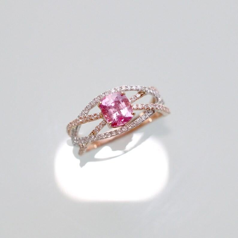 Dual Tone Pink Sapphire Ring w All Natural Accent Diamonds in 14k White and Rose Gold  Crossover Shank  Cushion 6.5mm  Customizable

Simply stunning and feminine, the accent diamonds pair perfectly with the pink sapphire's luscious tones! The two