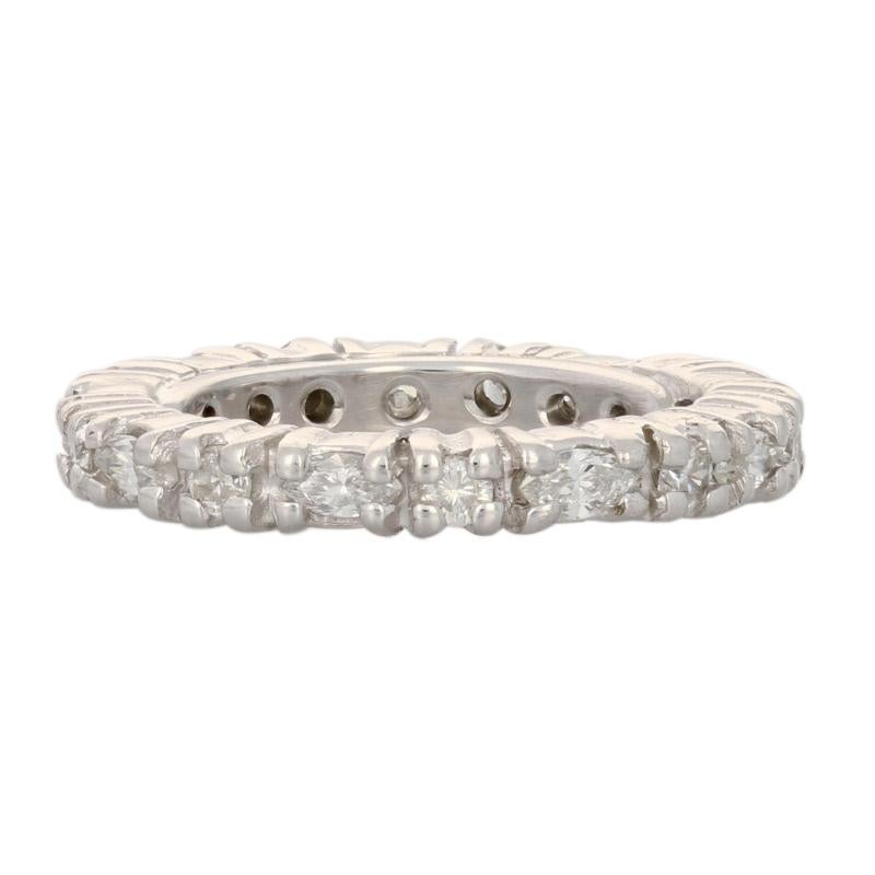 Begin the next chapter of your love story with this breathtaking ring! Fashioned in a sentimental eternity design, this 14k white gold wedding band showcases sparkling marquise cut and round brilliant cut diamonds arranged in a beautiful alternating