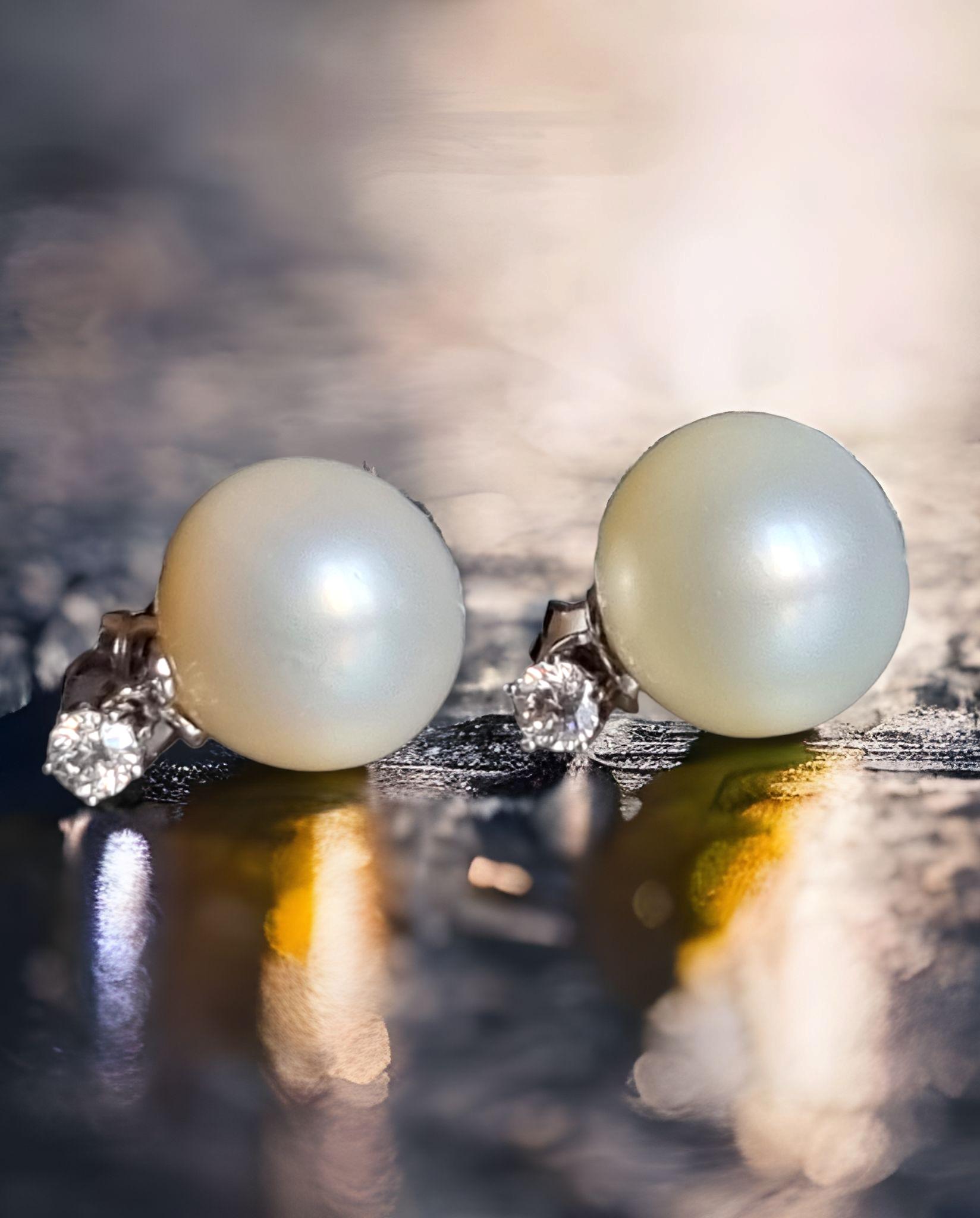 South Sea Pearls and Diamond  Dangle Earrings
These exquisite pearl earrings feature two 12.35 and 12.55mm AAA Quality White South Sea cultured pearls, displaying an incredible luster and white-creamy overtones. The pearls are mounted on the finest
