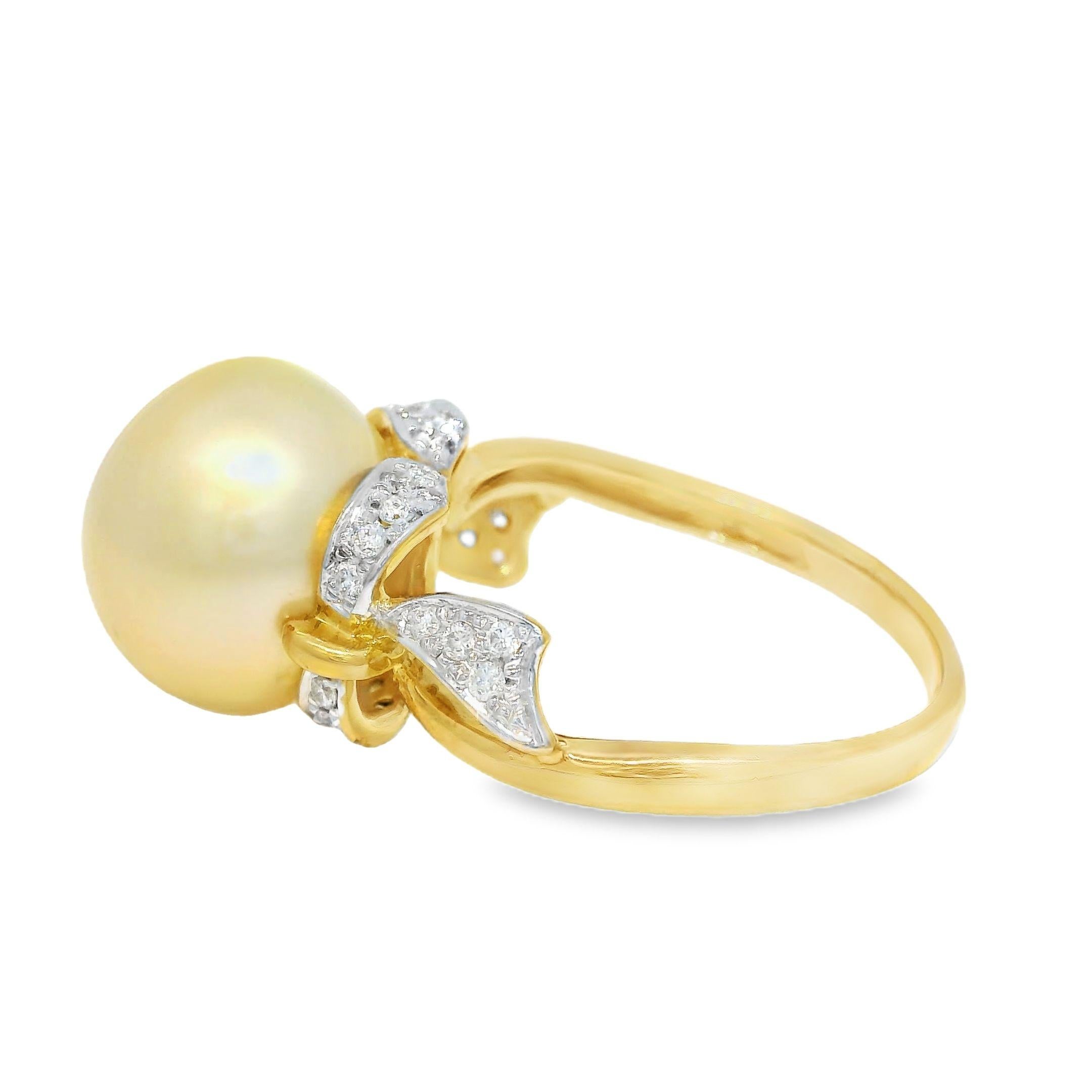 This exquisite ring features a stunning 12mm golden South Sea pearl, known for its exceptional luster and rich, warm hue. The pearl is beautifully accented by 0.23 carats of sparkling diamonds, meticulously set to enhance its natural beauty. The
