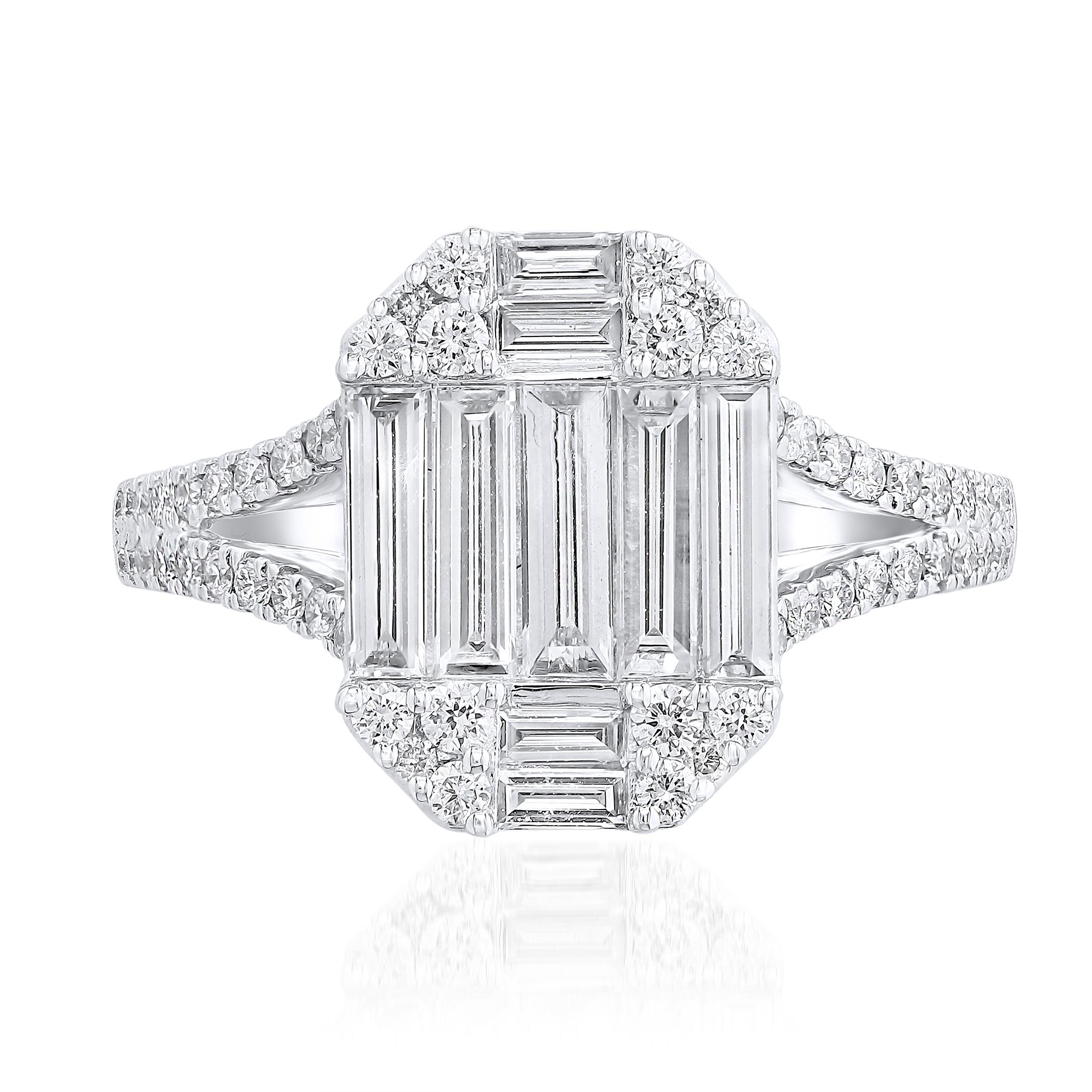 A brilliant and unique piece featuring a cluster of baguette diamonds shaped like an emerald cut, and a split shank setting accented with diamonds.. 10 Baguette diamonds weigh 0.86 carats total; 56 round diamonds weigh 0.41 carats total. Made in 18k