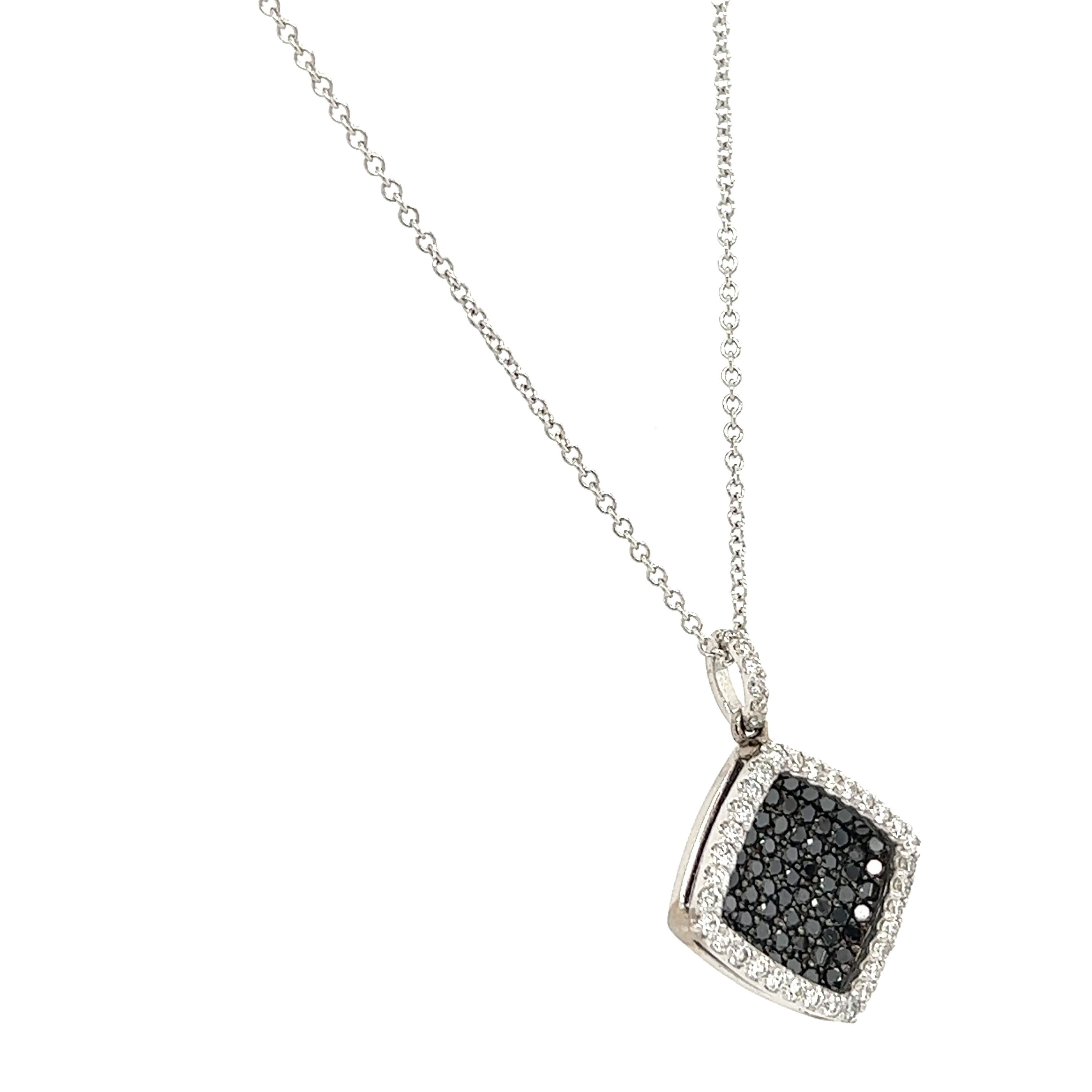 This necklace has Natural Black Diamonds that weigh 0.87 carats and Natural Round Cut Diamonds that weigh 0.40 carats. 
(Clarity: VS, Color: H) The total carat weight of the chain necklace is 1.27 carats.

The necklace is made in 14 Karat White Gold
