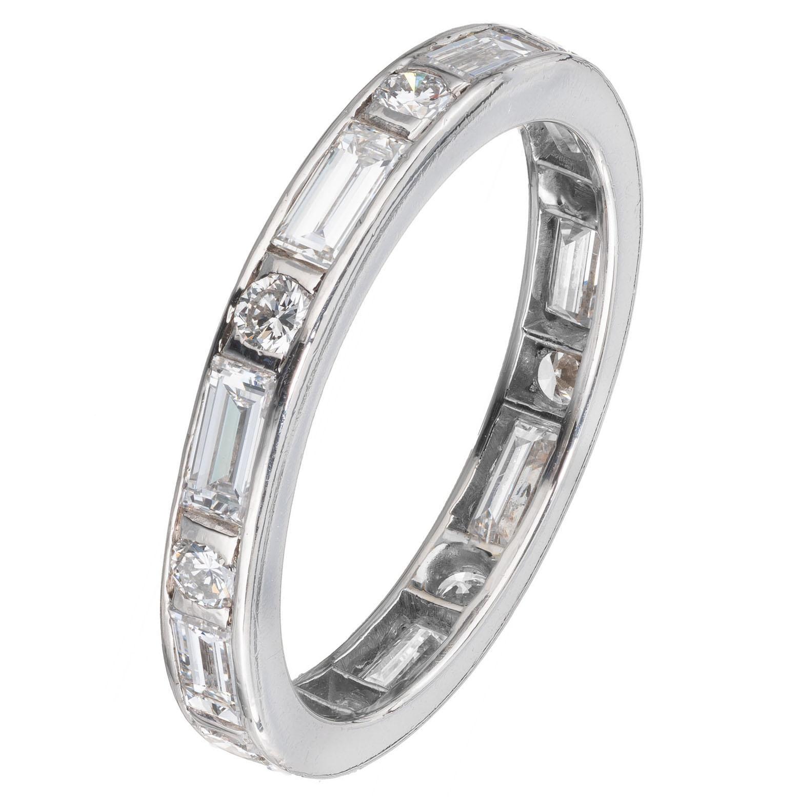 Alternating round and baguette diamond platinum wedding band ring. 

4 straight cut baguettes H VS, approx. 1.00ct
9 round brilliant cut diamonds H VS, approx. .27ct
Size 6 and not sizable 
Platinum 
3.3 grams
Width at top: 2.8mm
Height at top: