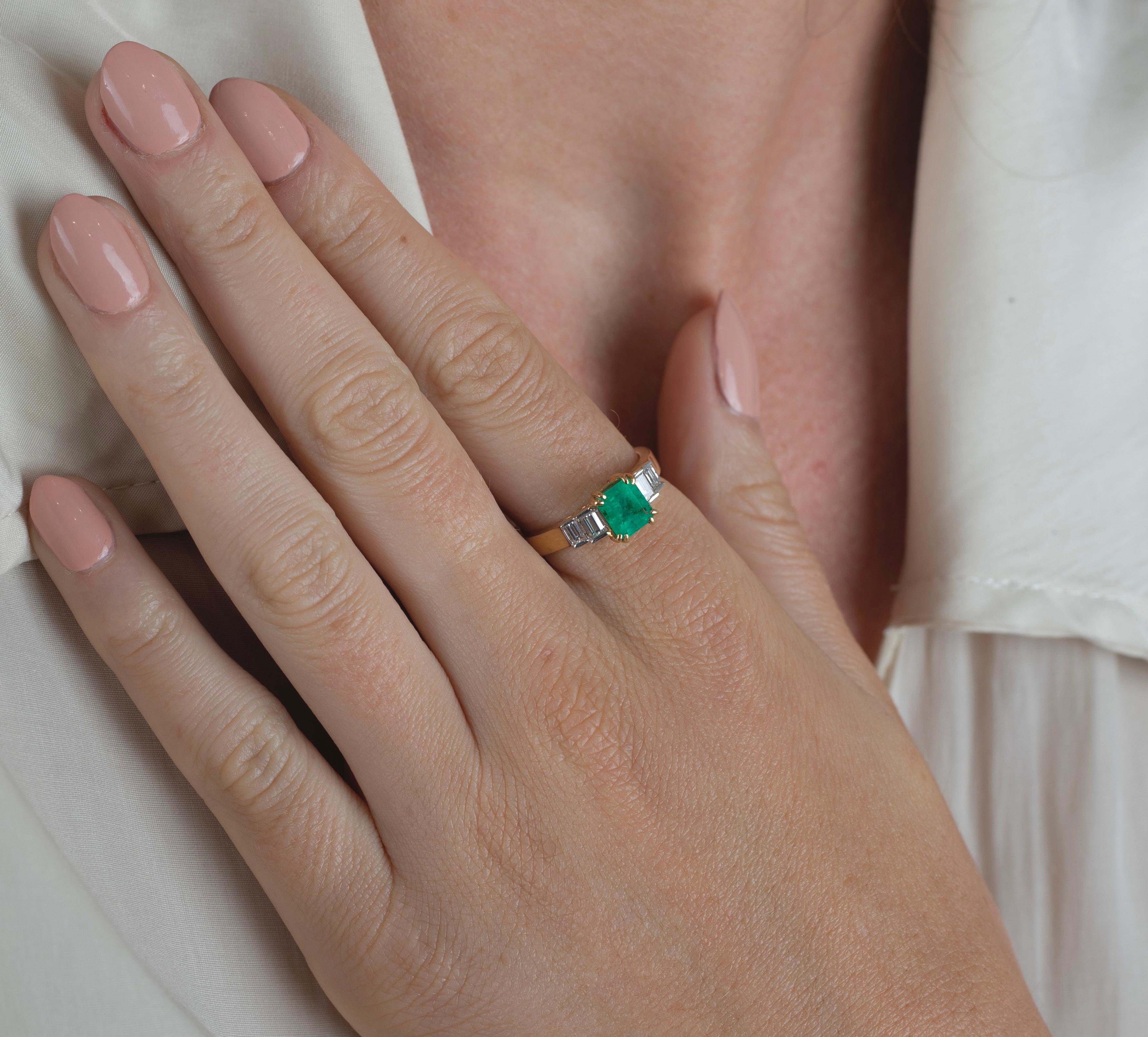 Centering a 1.5 carat, Emerald-Cut Colombian Emerald, flanked by 4 Baguette-Cut Diamonds and set in 18K Yellow Gold. 

Details: 
✔ Stone: Emerald
✔ Stone Cut: Emerald 
✔ Emerald Weight: 1.5
✔ Emerald Origin: Colombia
✔ Setting: 18K Yellow Gold,
