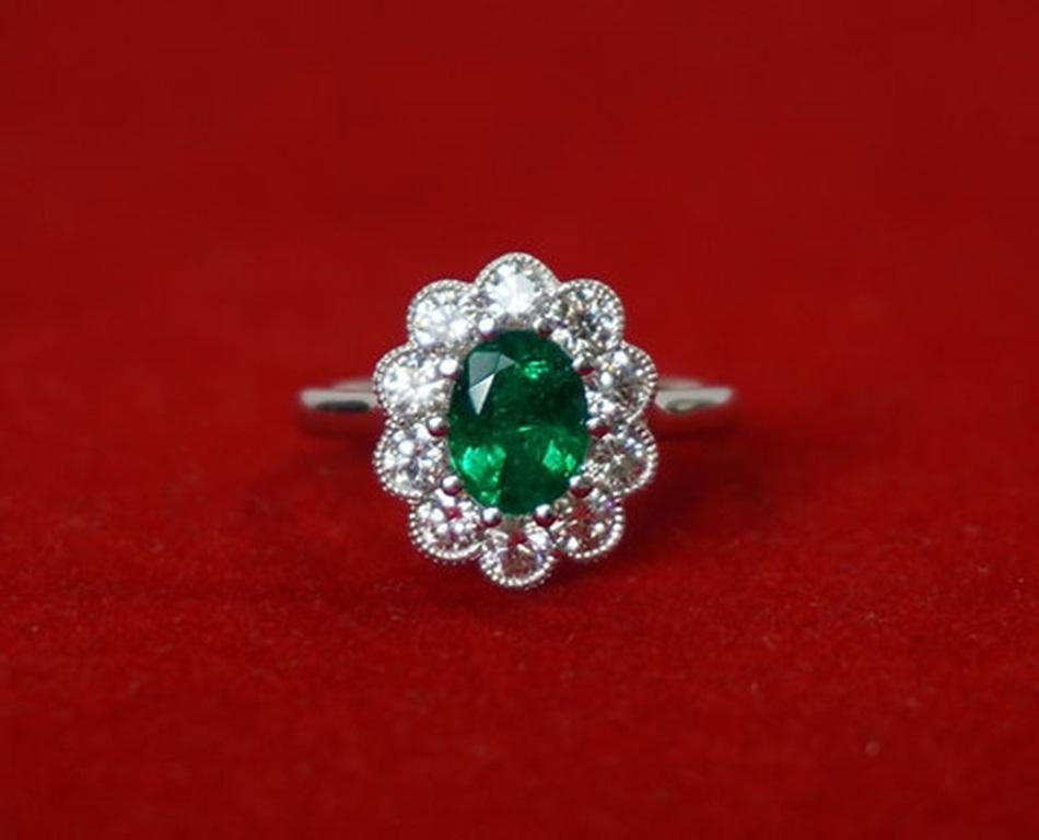 Emerald Weight: 1.27 CT, Diamond Weight: 1.00 CT, Metal: 18K White Gold, Ring Size: 6, Shape: Oval, Color: Intense Green, Hardness: 7.5-8, Birthstone: May