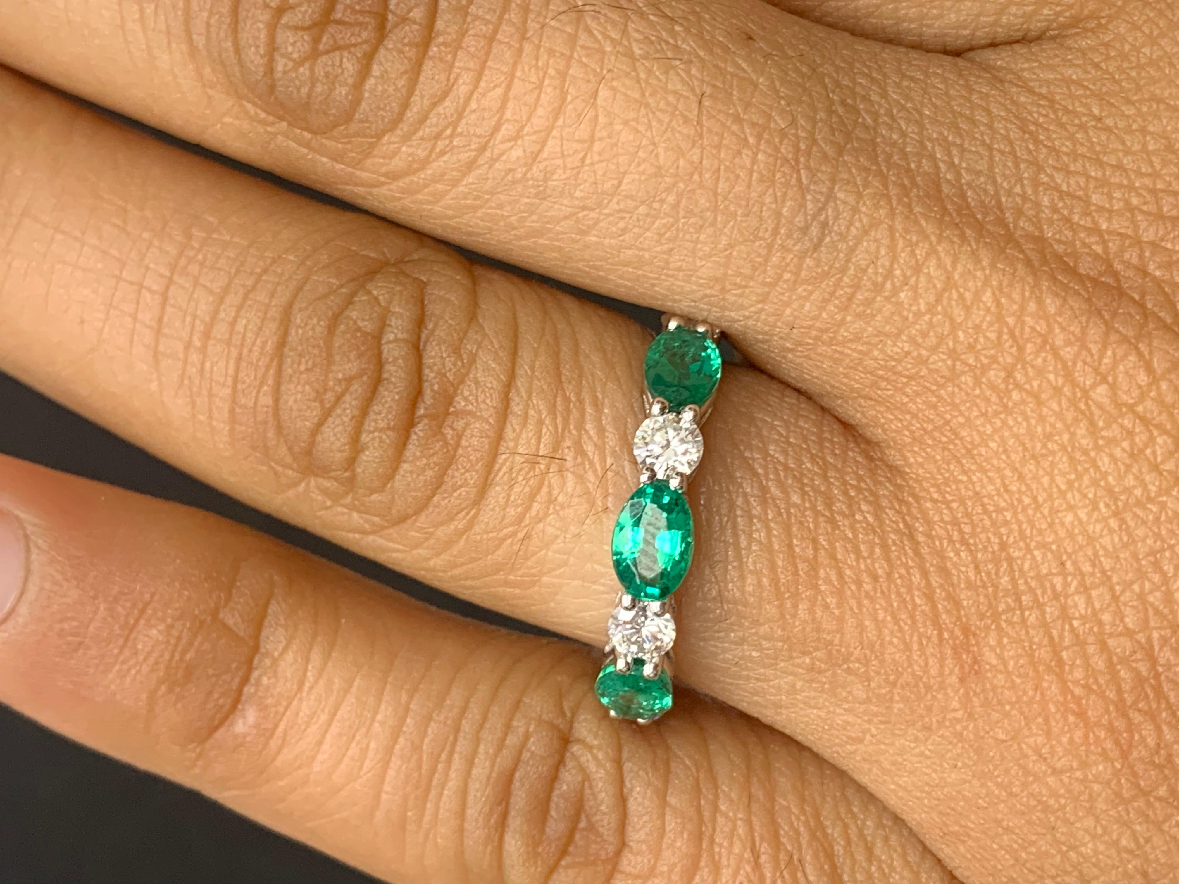 Handcrafted to perfection; showcasing color-rich oval cut emeralds that elegantly alternate round diamonds in a 14k white gold setting. 
The 3 emeralds weigh 1.27 carats total and 4 diamonds weigh 0.61 carats total.

Size 6.5 US (Sizable). One of a