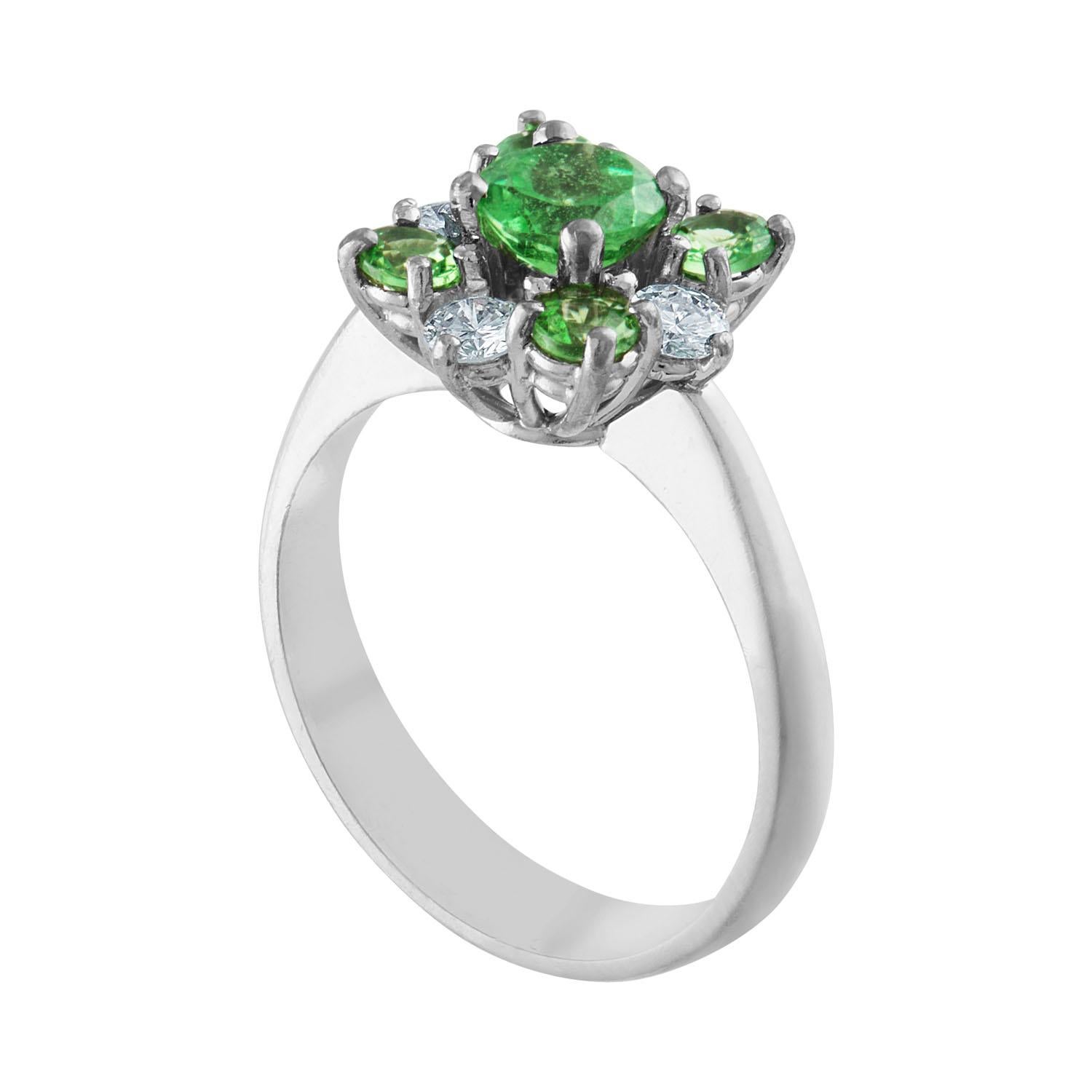The Cluster Ring is 18K White Gold.
There are 1.27 Carats in Tsavorite.
There are 0.40 Carats in Diamonds F VS.
The ring is a size 7.0, sizable.
The ring weighs 5.1 grams.