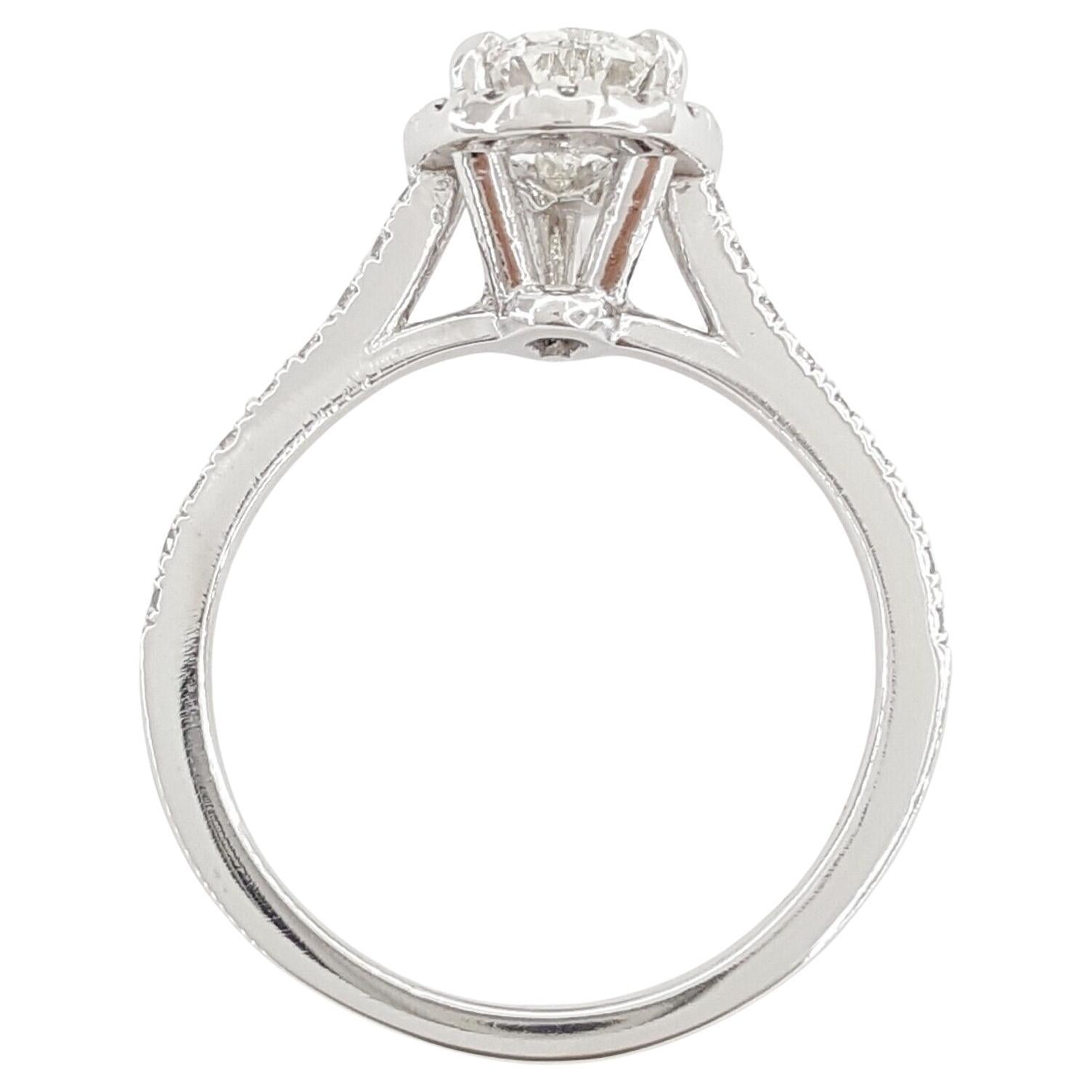0.91 ct Pear Brilliant Cut Diamond Halo Engagement Ring in Platinum. 
The ring weighs 5.3 grams, size 6, the center stone is a Natural 0.91 ct Pear Brilliant Cut Diamond, G in color, VS2 in clarity, Good Polish, Good Symmetry, with measurements of
