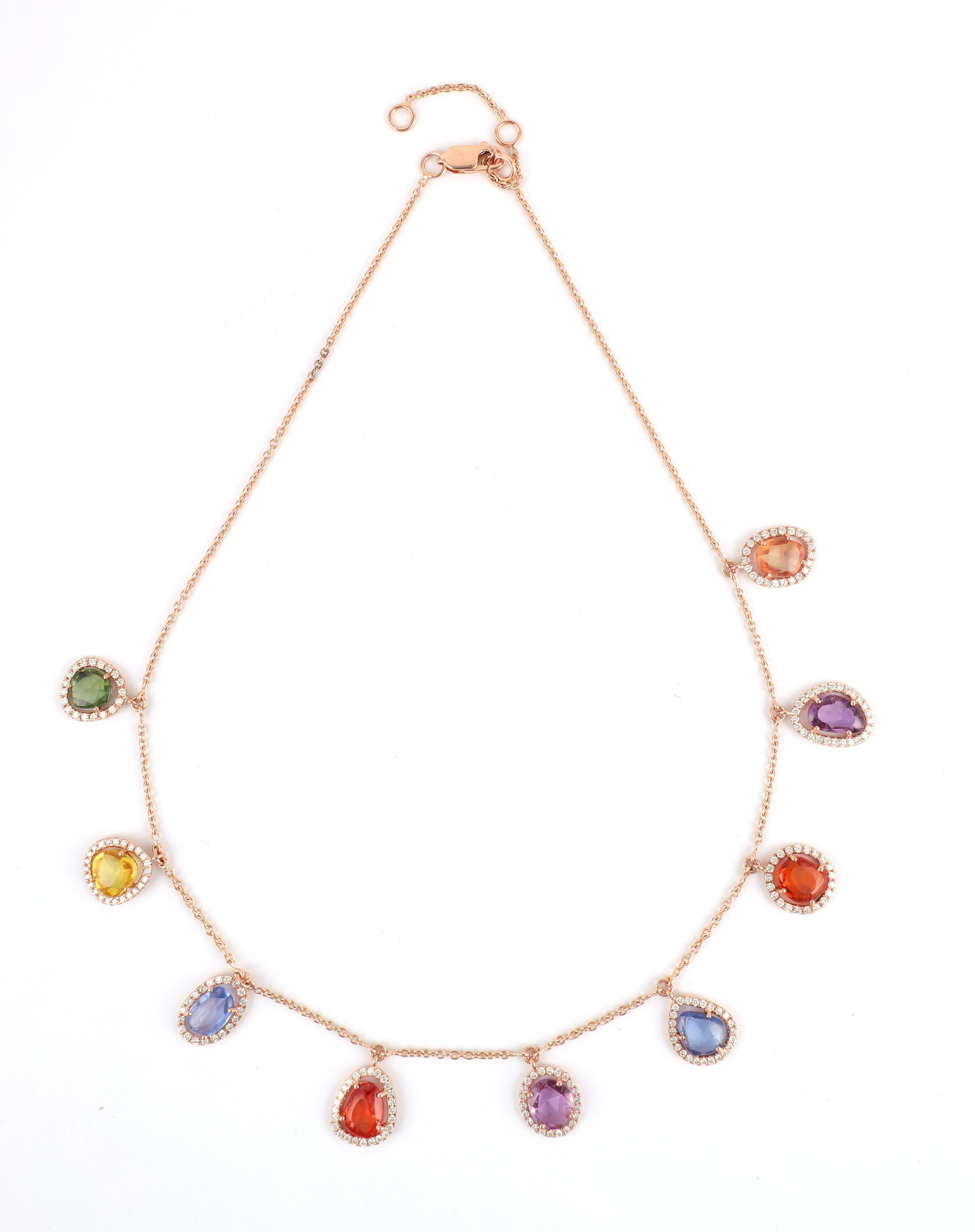Multi-Colors Rainbow Sapphire Chain Necklace in 18K Rose Gold studded with mix cut sapphire pieces.
Accessorize your look with this elegant Blue sapphire chain necklace. This stunning piece of jewelry instantly elevates a casual look or dressy