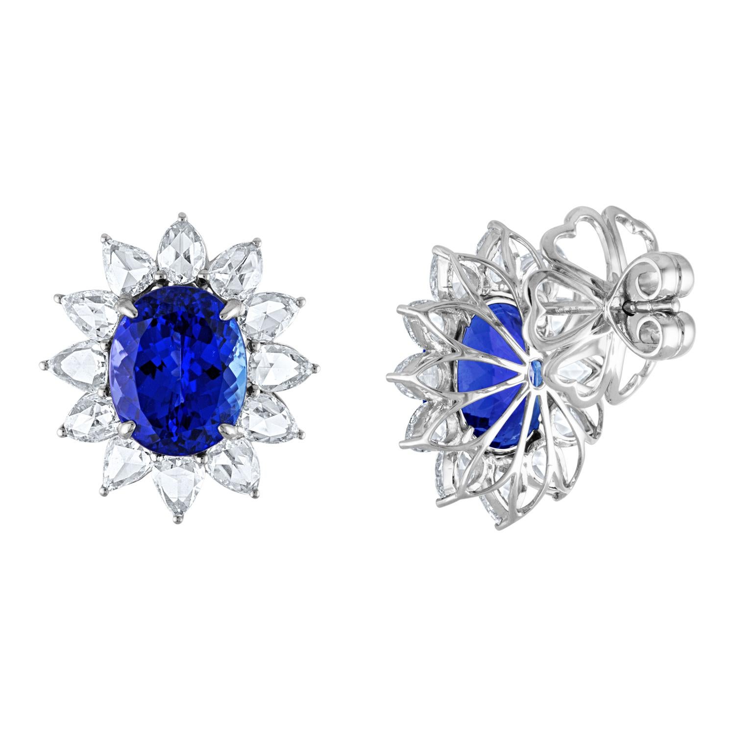 Custom One of a Kind Earrings
The earrings 18K White Gold
There are 3.87 Carats in Rose Cut Pear Shaped Diamonds F VS
The center stones are Tanzanite totaling 12.70 Carats
The earrings measure 21.00mm x 19.00mm
The earrings weigh 12.00 grams