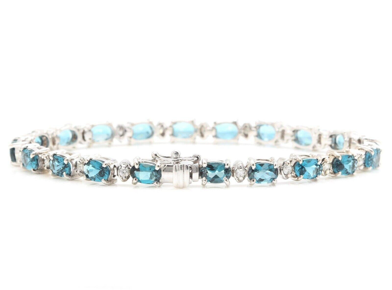12.70 Carats Natural London Blue Topaz & Diamond 14K Solid White Gold Bracelet 

Suggested Replacement Value: $7,000.00

STAMPED: 14K

Total Natural Round Diamonds Weight: Approx. 0.70 Carats (color G-H / Clarity SI)

Total Natural Topaz Weight is: