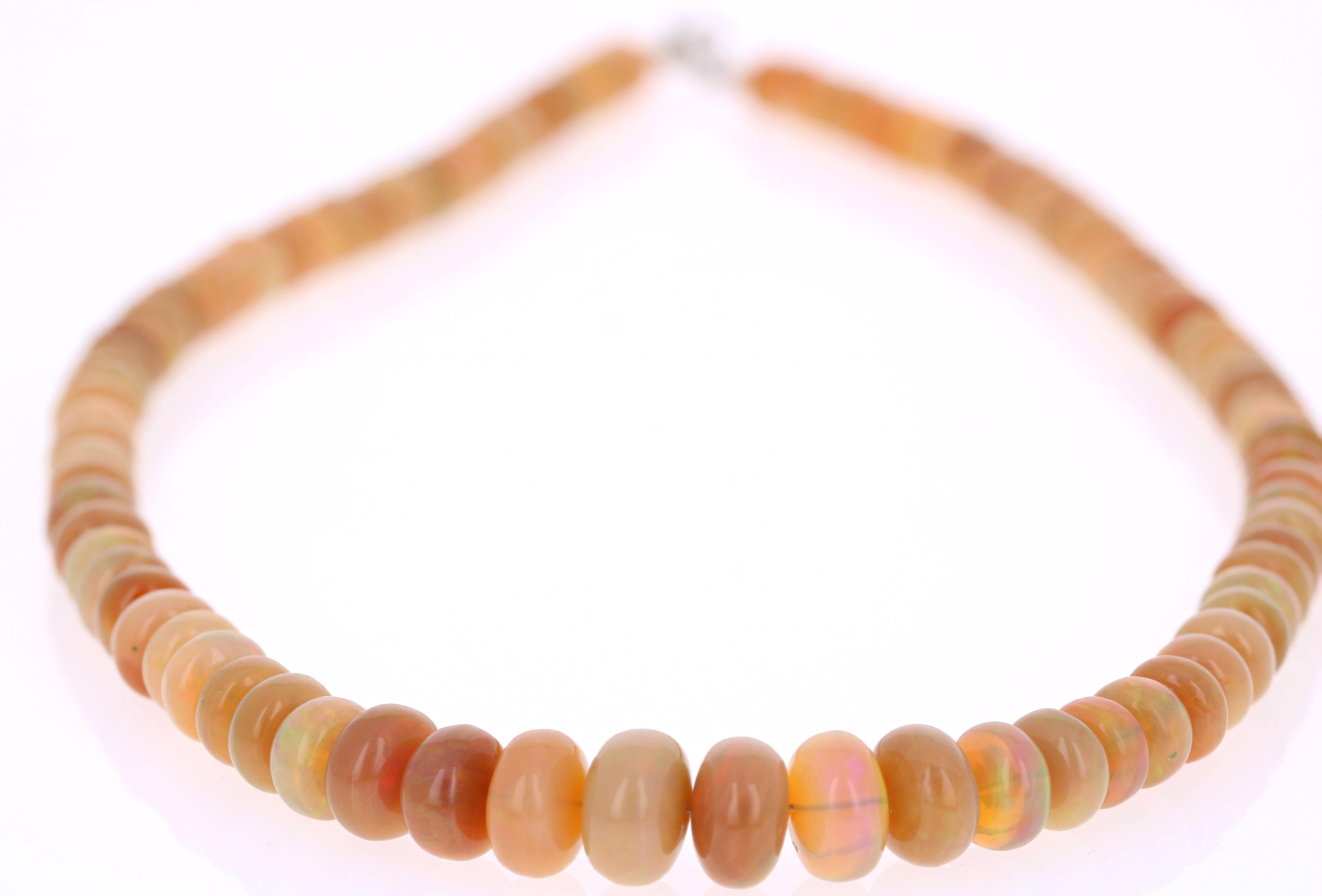 Gorgeous Ethiopian Opal Necklace with beautiful flashes of color. This rare strand of Opals with colors ranging from orange, yellow, peach, tan, and coral have green, pink, yellow and some red flashes of color. These opals have an origin of