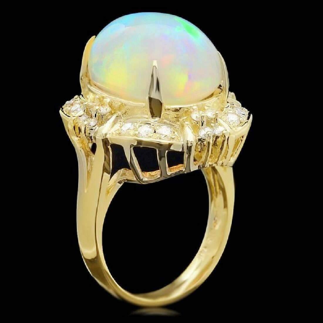 12.70 Carats Natural  Impressive Ethiopian Opal and Diamond 14K Solid Yellow Gold Ring

Total Natural Opal Weight is: Approx. 12.00 Carats

Opal Measures: 18.00x 13.00mm

Total Natural Round Diamonds Weight: Approx. 0.70 Carats (color G-H / Clarity