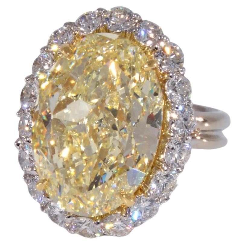 12.71 carat GIA Canary Yellow Oval Diamond with Diamond Halo Ring For Sale