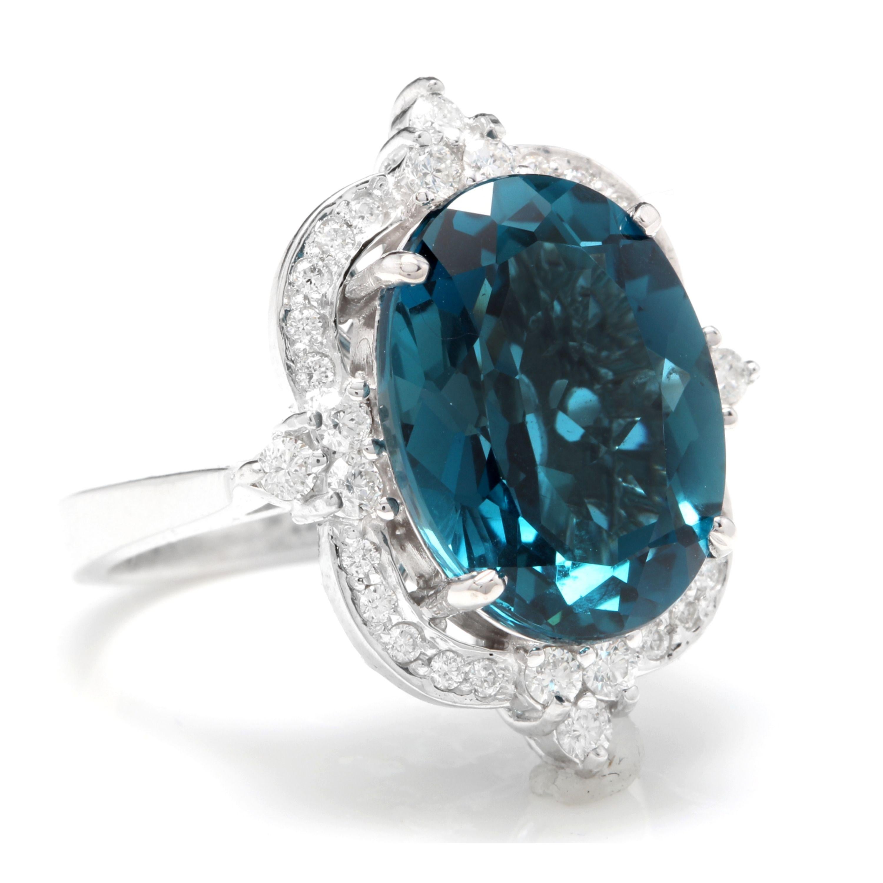 12.75 Carats Natural Impressive London Blue Topaz and Diamond 14K White Gold Ring

Total Natural London Blue Topaz Weight: Approx. 12.00 Carats

London Blue Topaz Measures: Approx. 15 x 11mm

Natural Round Diamonds Weight: .75 Carats (color G-H /