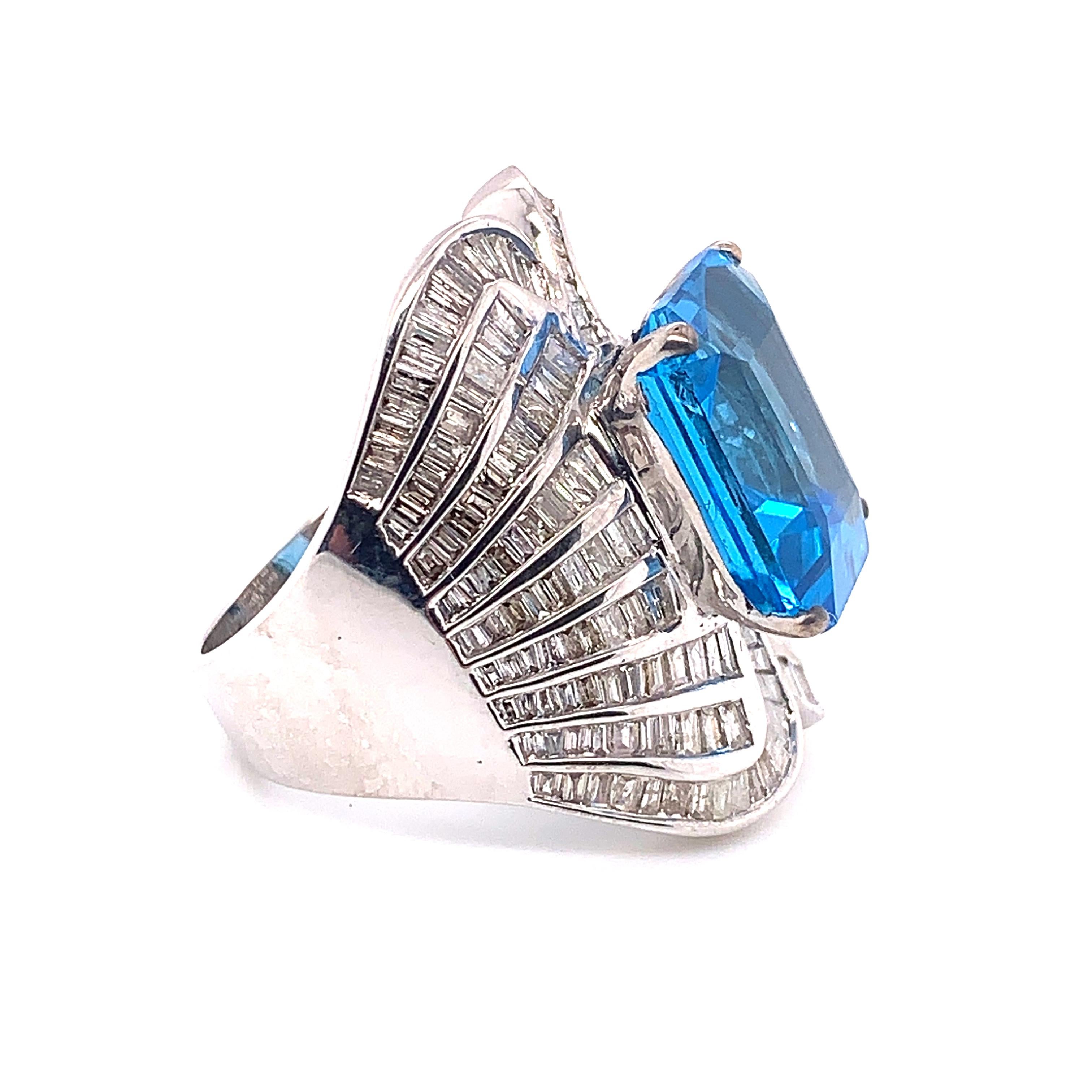12.78 Carat Blue Topaz and Diamond ring made by Shimon's Creations. Featuring a Bright and happy 10.53 carat topaz and 2.25 Carat stunning white diamonds in 18k white gold.

Color Stone And Diamond Breakdown:
Blue Topaz - 10.53 Carat
White Diamond -