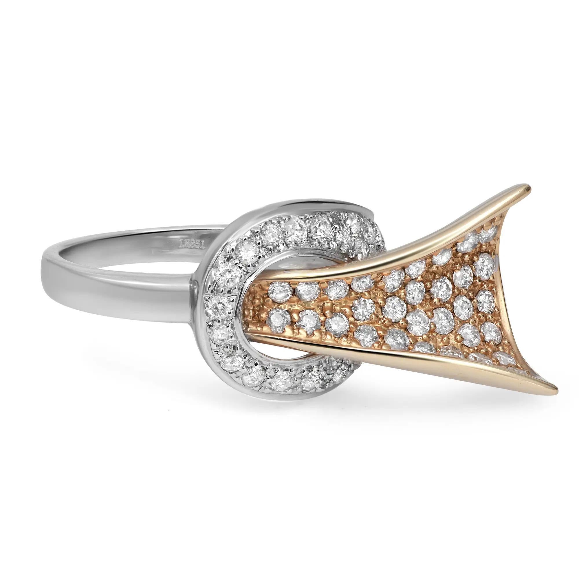Dazzle away with this bold two tone ladies cocktail ring. Crafted in 14k white and yellow gold. Showcasing pave set round brilliant cut diamonds weighing 1.27 carats. Diamond quality: I color and SI1 clarity. Ring size: 7.5. Total weight: 7.09