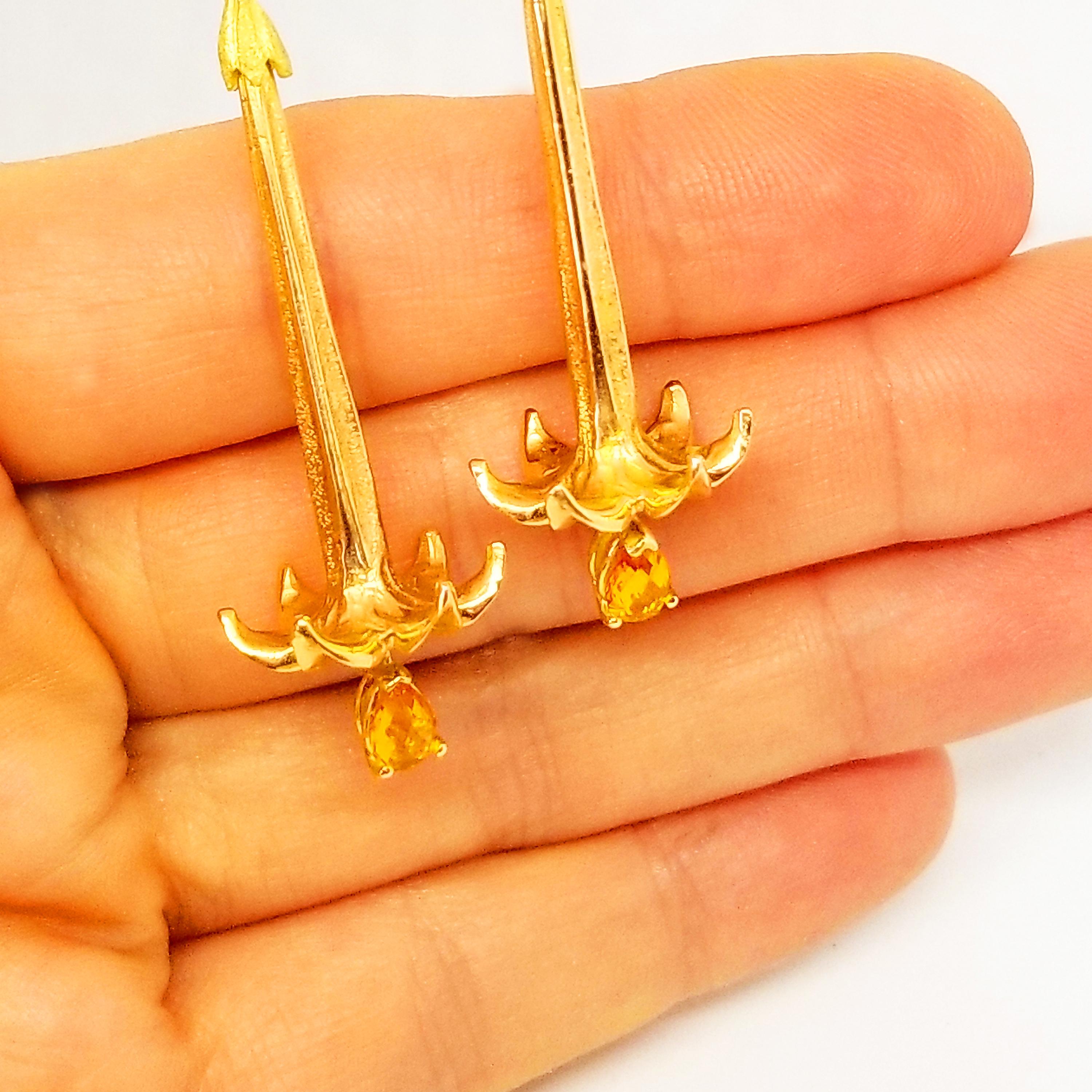 These Long and Elegant Earrings are One of a Kind in 18K Yellow and Rose Gold featuring faceted, Pear Shape Briolette Sapphires of Deep Canary Yellow Hue and Gem Quality. Each Gemstone is prong set and hangs as a moving dangle below a long, Hand