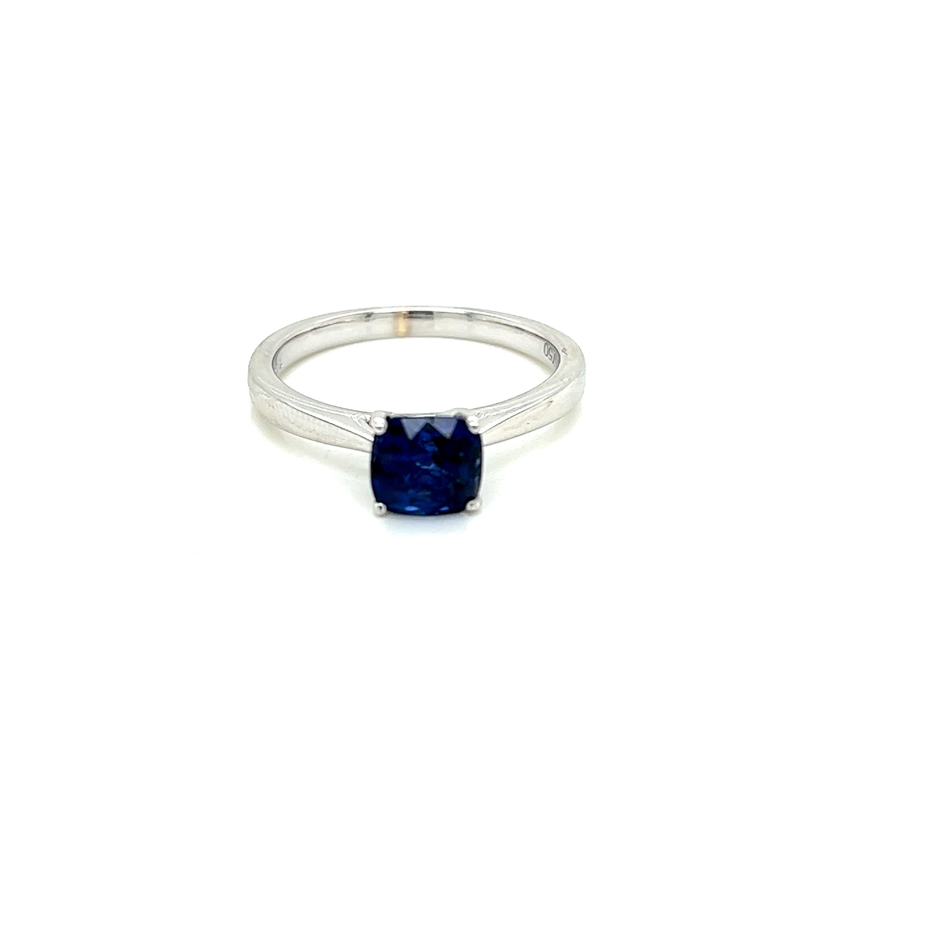 This classic solitaire ring features a 1.28 carat cushion cut Blue Sapphire at its centre. The resplendent jewel is held in a claw setting on an 18K White Gold band.

This timeless piece is worthy of any special occasion.
