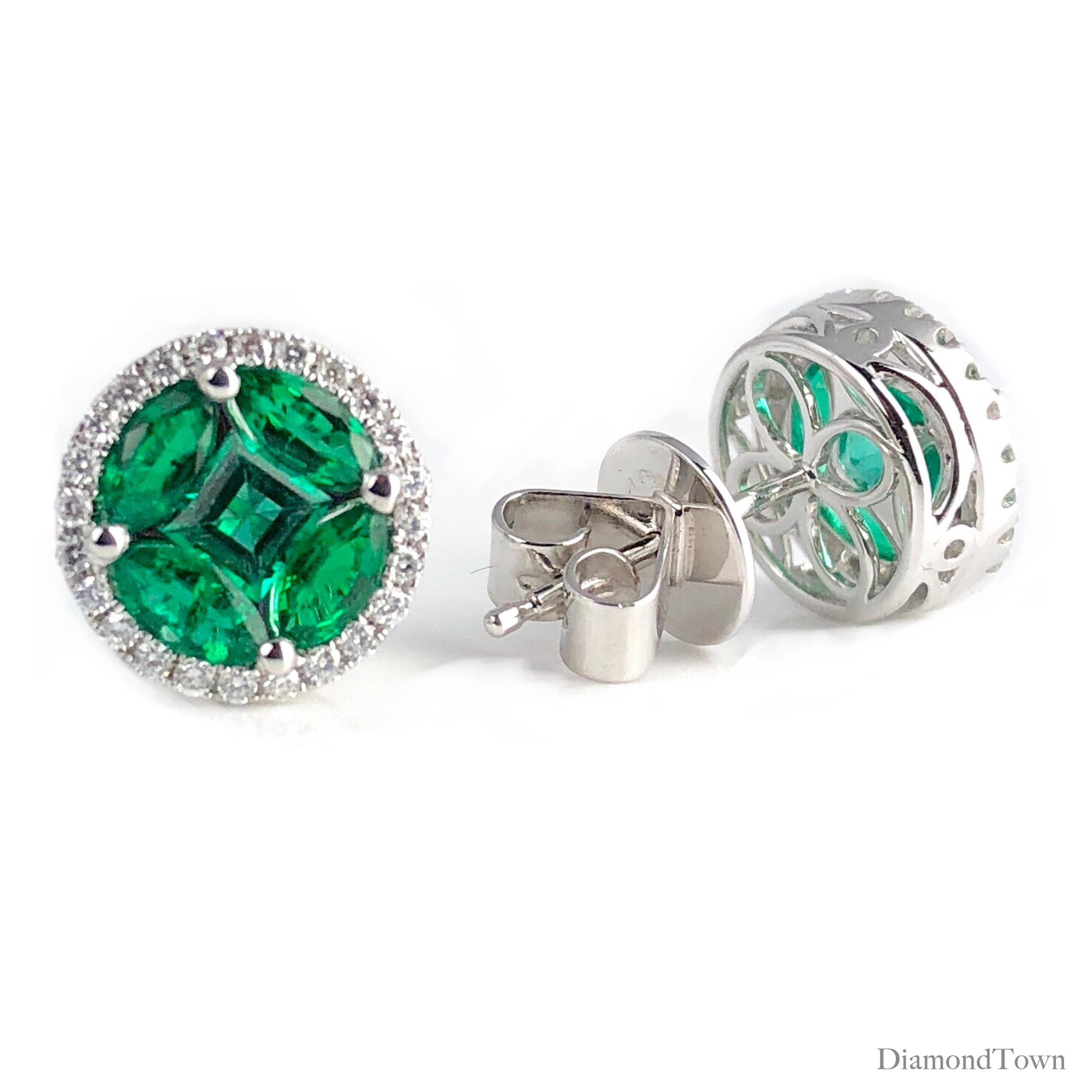 Introducing captivating round emerald stud earrings showcasing a vibrant cluster of brilliant green emeralds, totaling 1.28 carats, elegantly encircled by a dazzling halo of round natural diamonds, totaling 0.22 carats. Crafted in lustrous 18k White