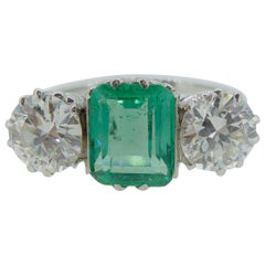 1.28 Carat Emerald and Diamond Ring in Three-Stone Platinum Mount, circa 1950s