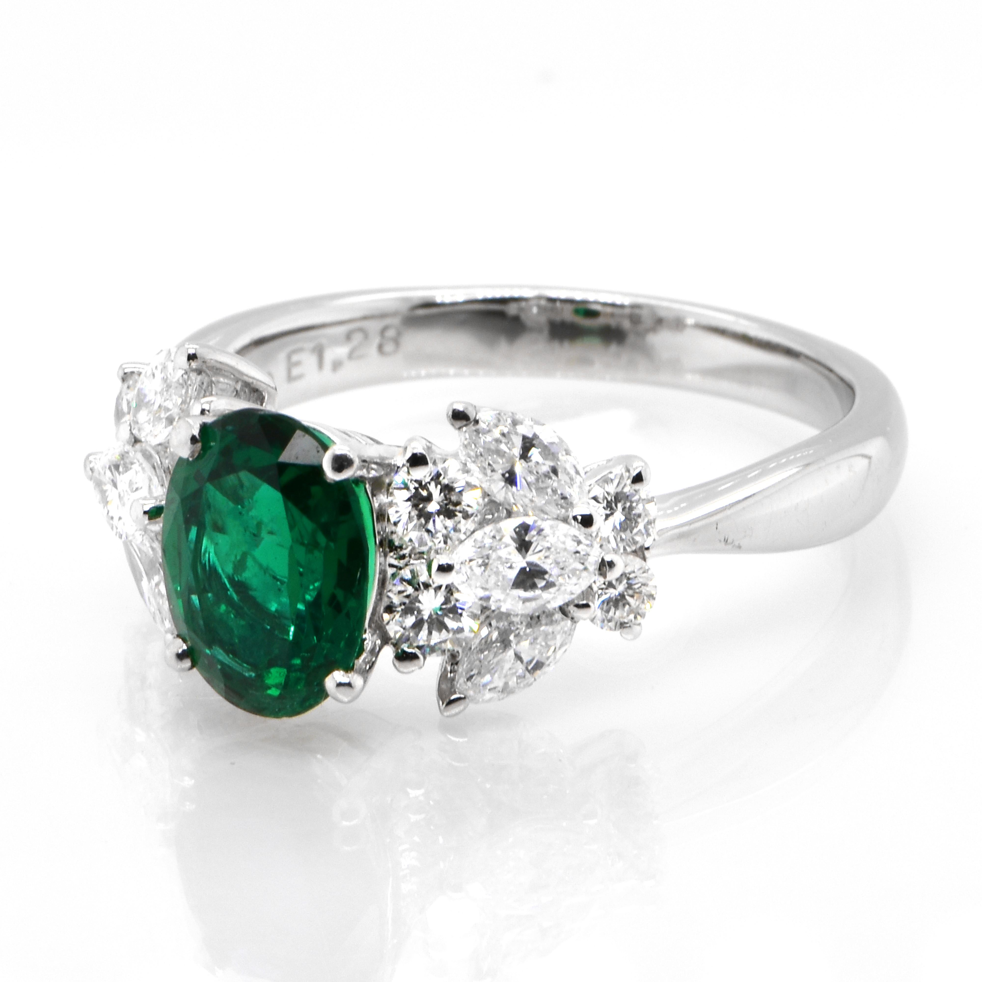 A stunning ring featuring a 1.28 Carat Natural Emerald and 1.04 Carats of Diamond Accents set in Platinum. People have admired emerald’s green for thousands of years. Emeralds have always been associated with the lushest landscapes and the richest