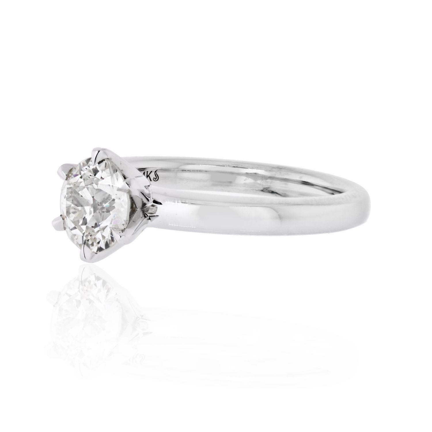 This solitaire style engagement ring is the perfect marriage of modern and vintage. It features a 1.28 carat Old European Cut diamond in a modern 14 karat, 2.5mm wide white gold setting. The diamond, has L color and SI2 clarity certified by GIA and